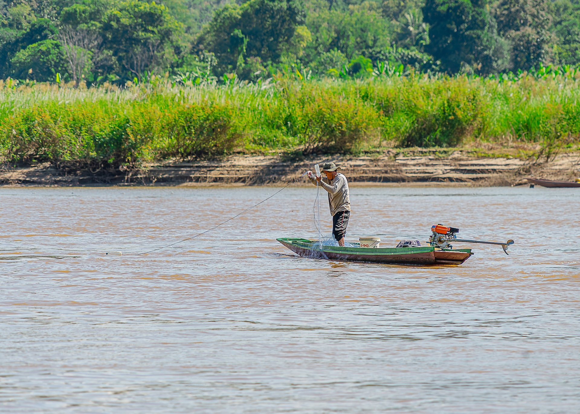 Fishing for life in Mekong River in Lua Prabang, Laos