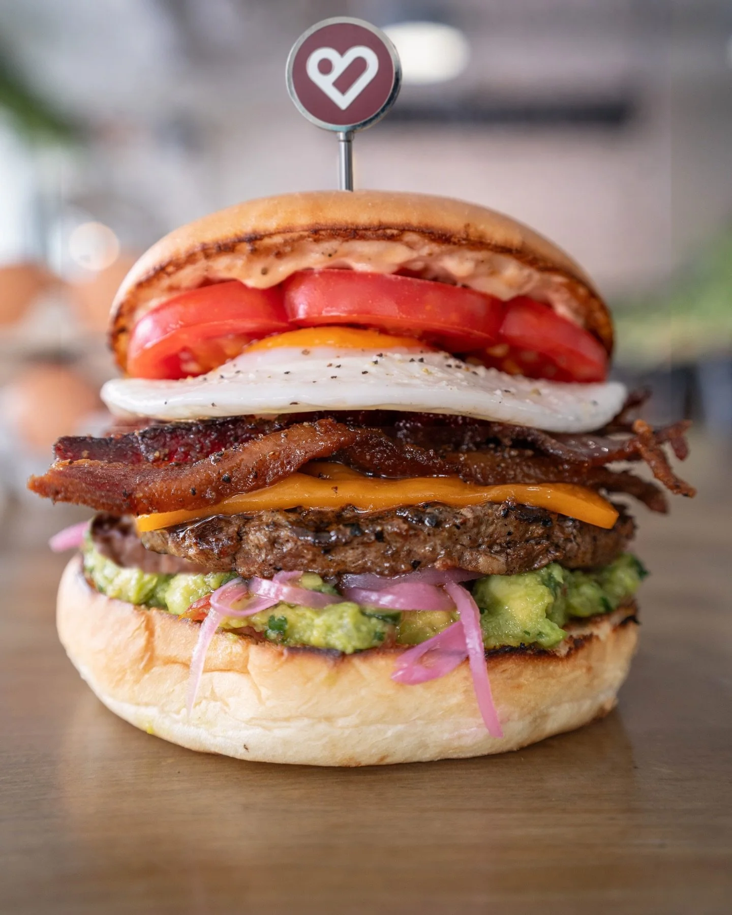 Welcome to Eggpril and say hello to our new Farm Burger

ORGANIC EGG from @naturesfarm 
FREE-RANGE MANITOBAN BEEF:
CANDIED BACON CHEDDAR CHEESEE GUACAMOLE:
TOMATO
CREAMY VERDE AIOLI