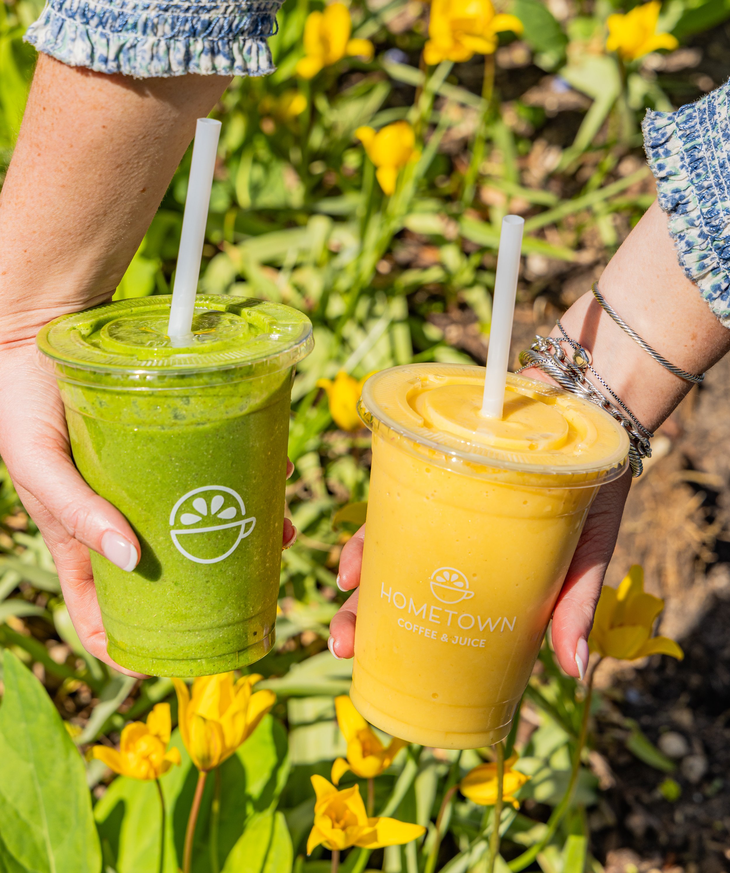Two smoothies one is yellow one is green