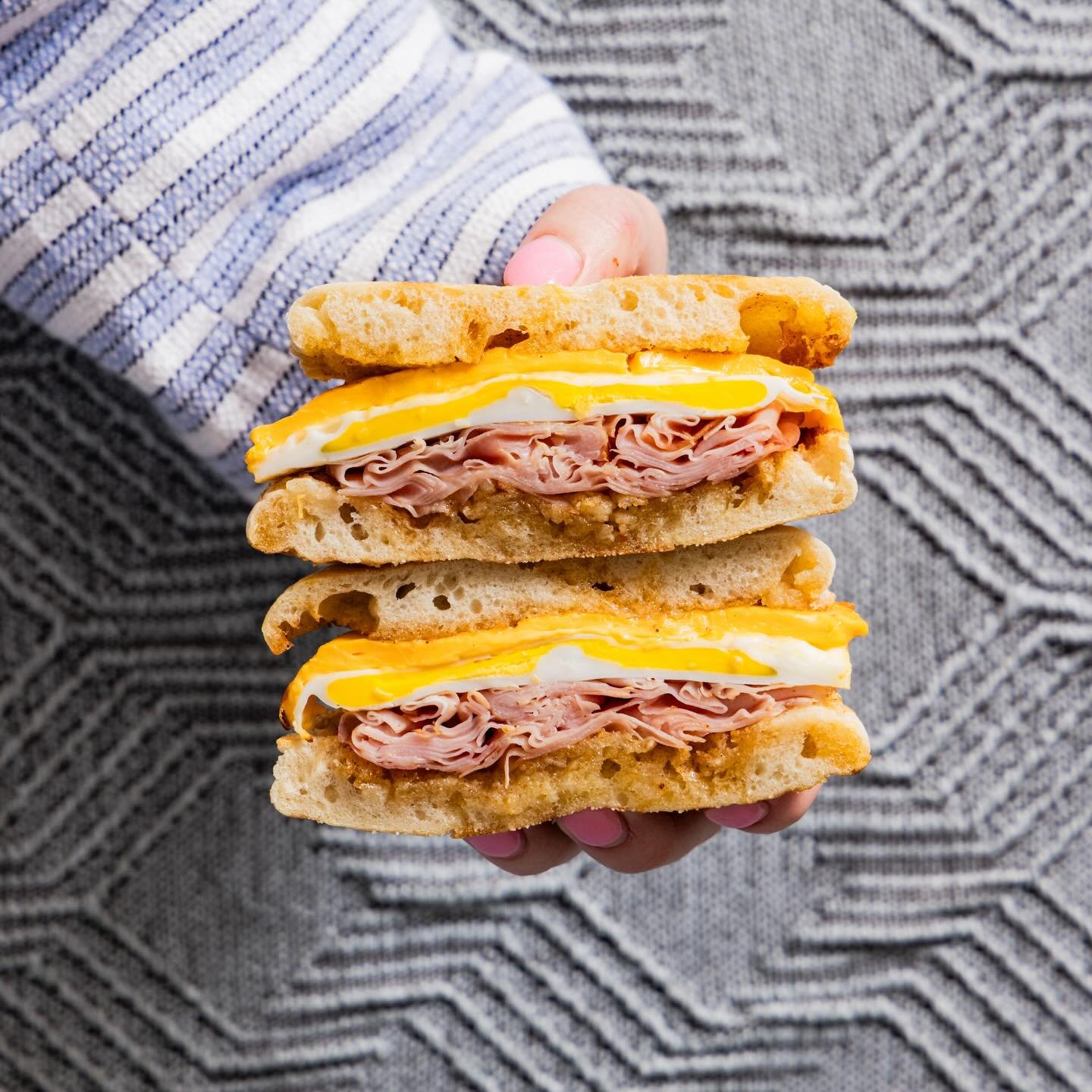 Meet your new breakfast favorite: The Kenny. 

Steamed egg, Canadian bacon, American cheese, and maple chili butter on a fresh English muffin.