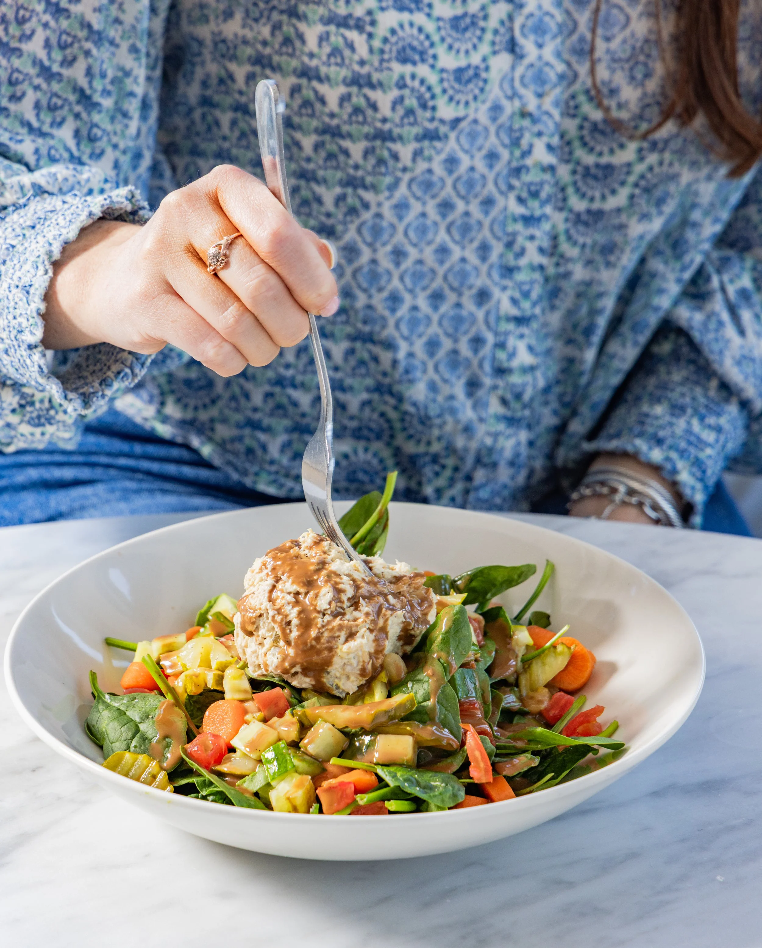 A woman eating a salad