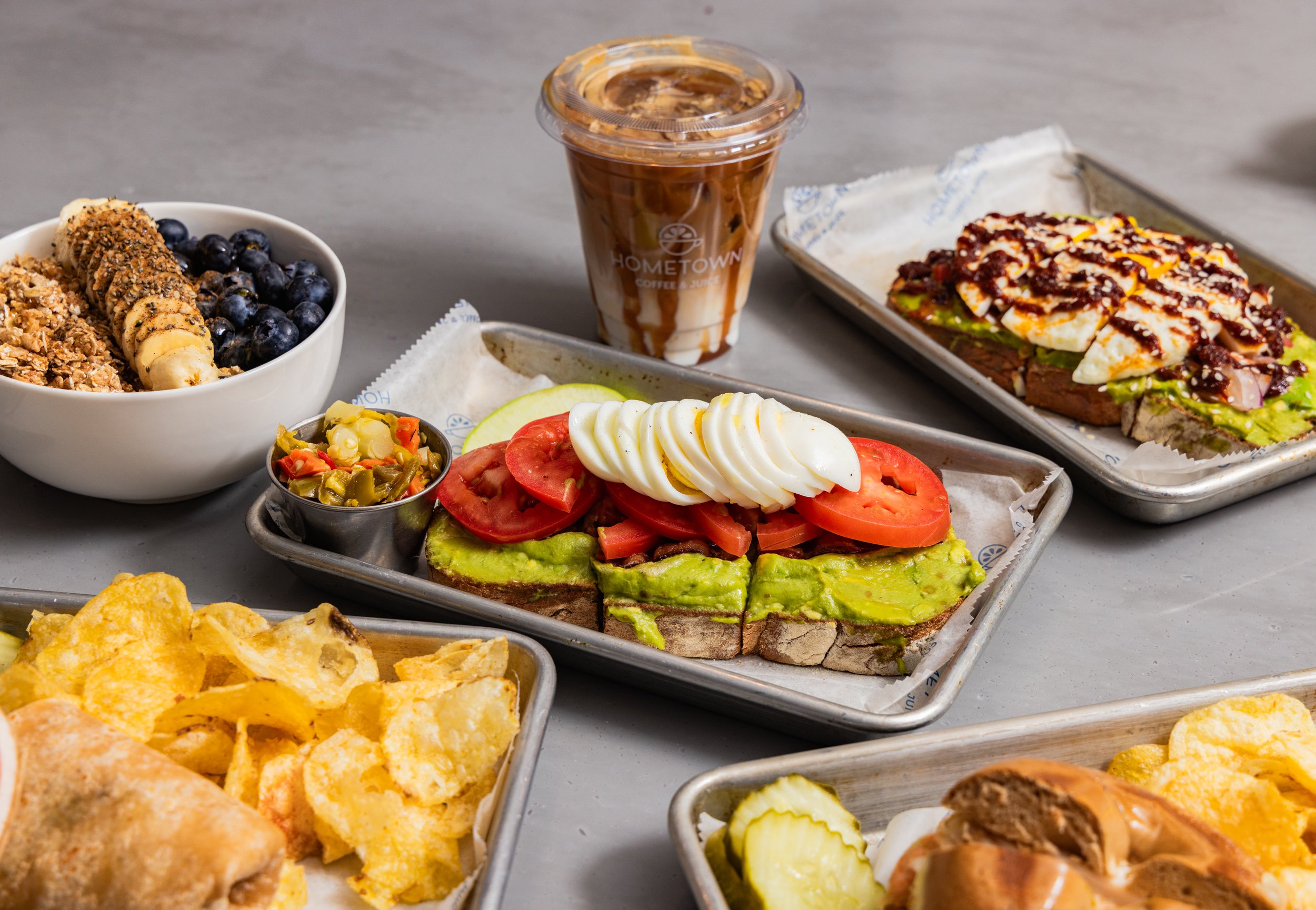 Anytime toast with an iced latte and granola bowl