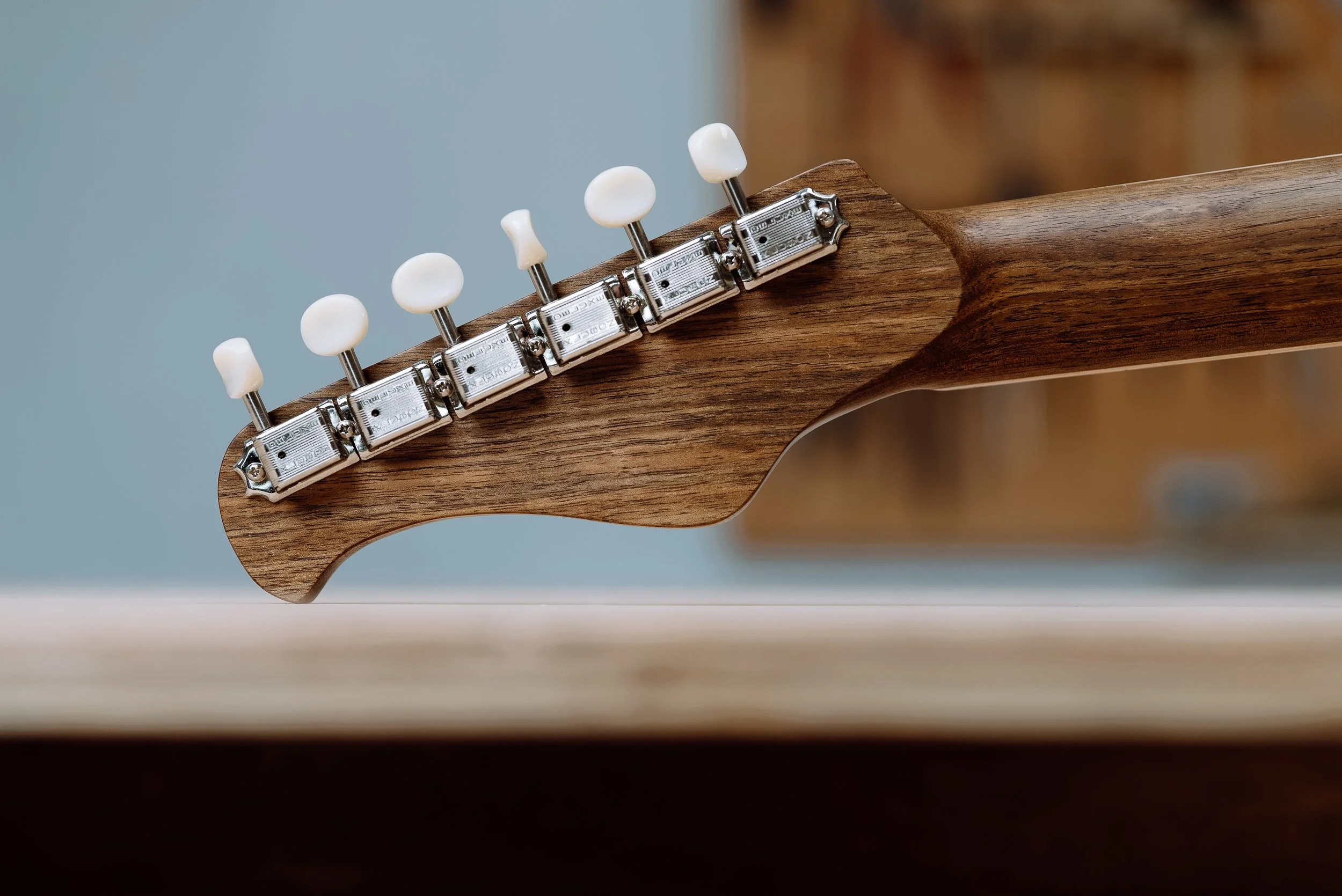 Close-up of guitar headstock with tuning pegs