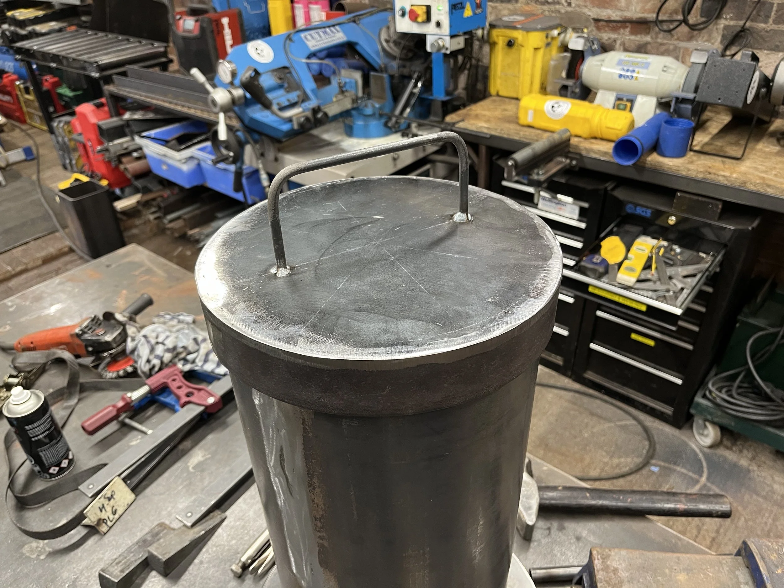 Custom filler neck and lid for an adhesives tank