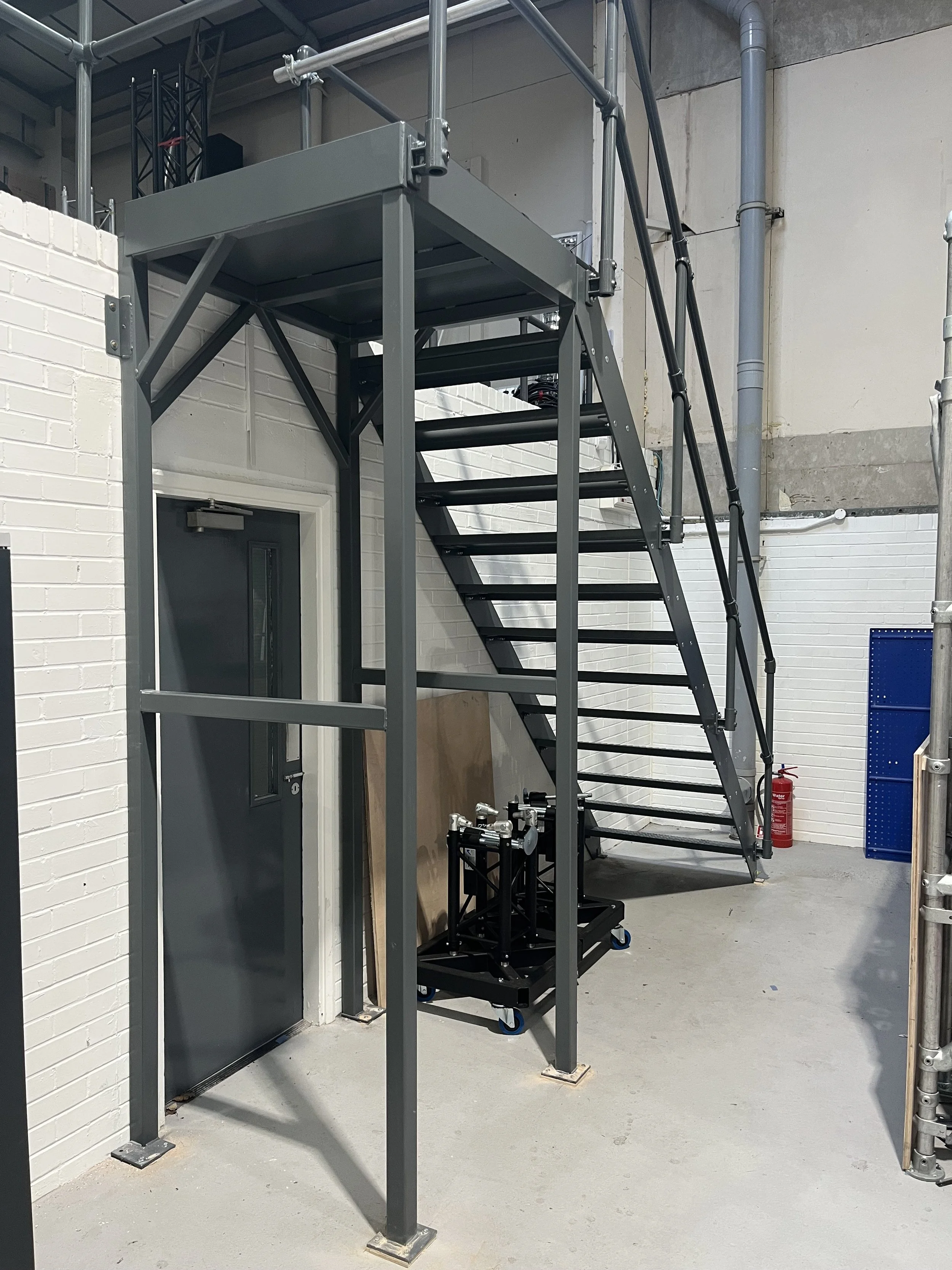 Manufacture and installation of a steel access stairs for a customers mezzanine floor