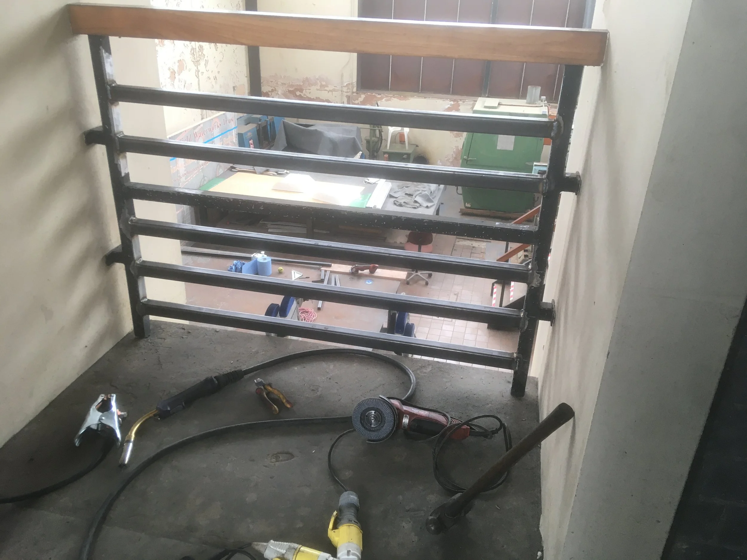 Modification to balcony hand railings to meet current standards.