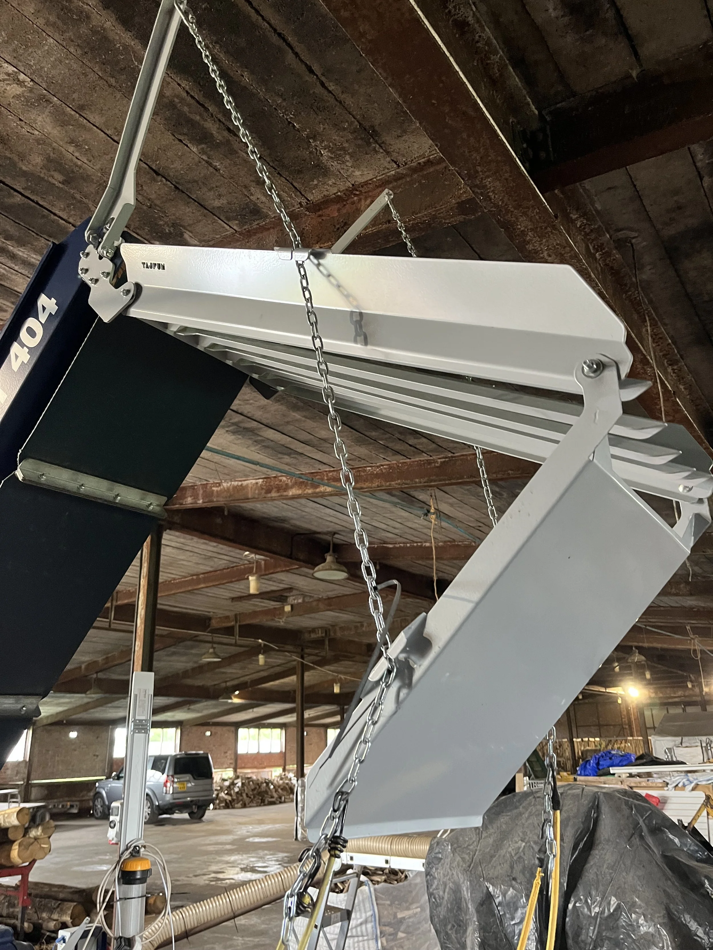 Conversion and addition of a Firewood processor conveyor