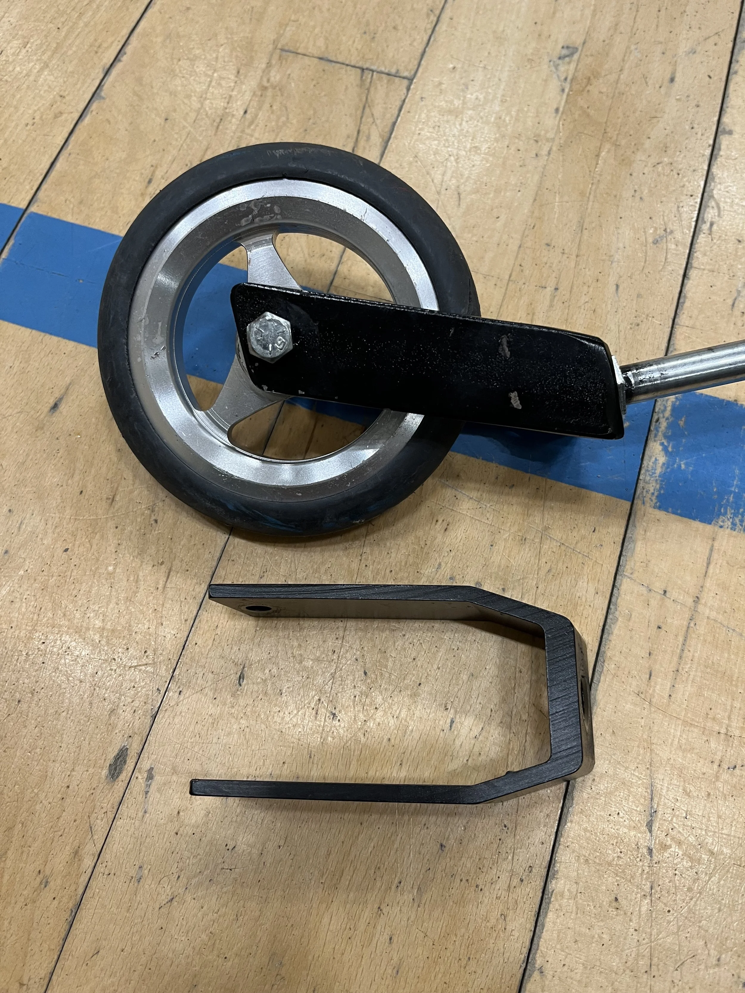 Two simple steel replacement wheel brackets for a local disabled football club, replacing the inferior aluminium manufacturers items