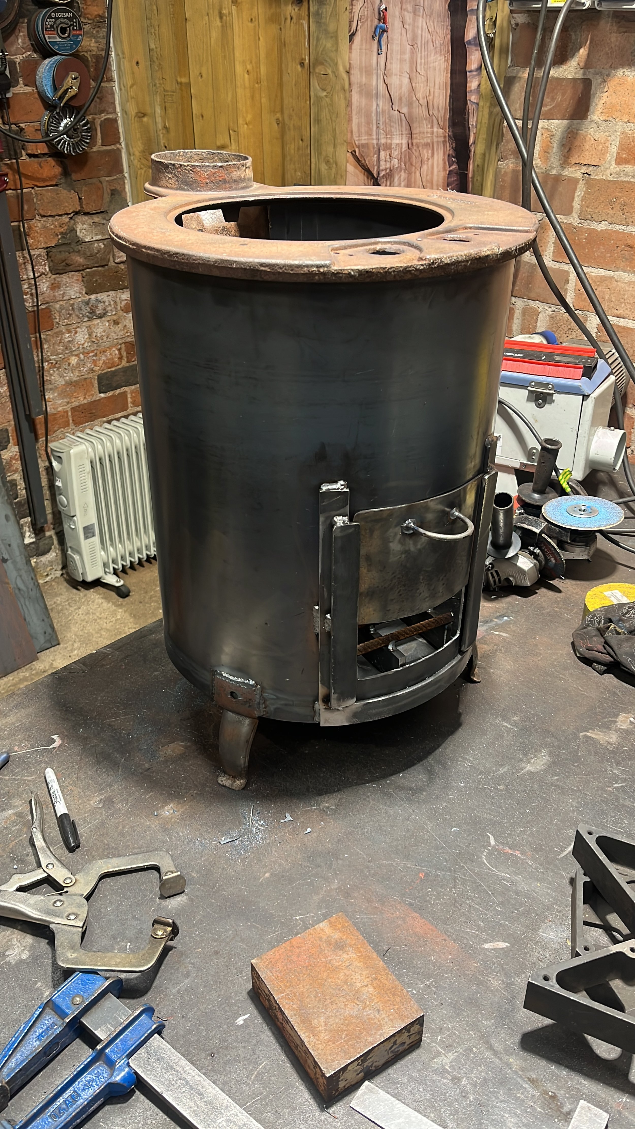 Complete rebuild of a workshop wood burner, additional cleaning door and new fire bars