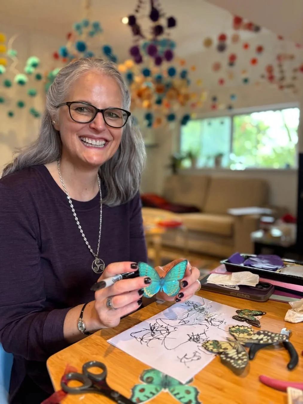 I was so busy last month that I didn't post anything about my Kinetic Art Retreat that happened in September. It was pure creative play. 

Here is @harpbeth who is also an amazing paper artist and harp player working on a mobile with paper butterflie