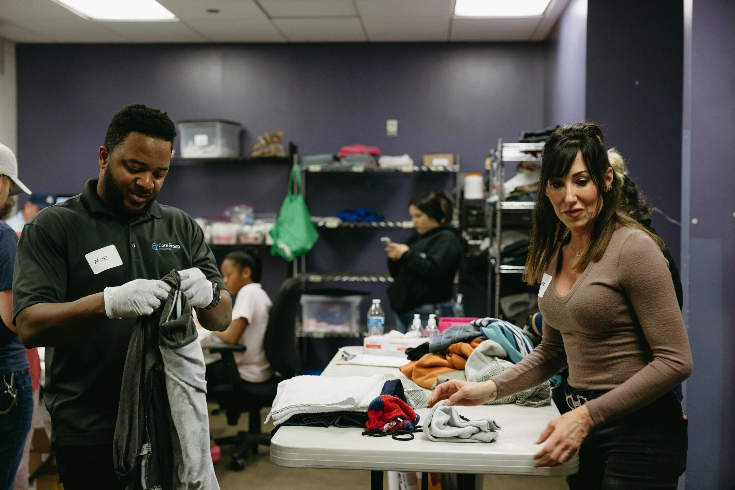 Volunteering at The Beacon Houston washing and folding clothes