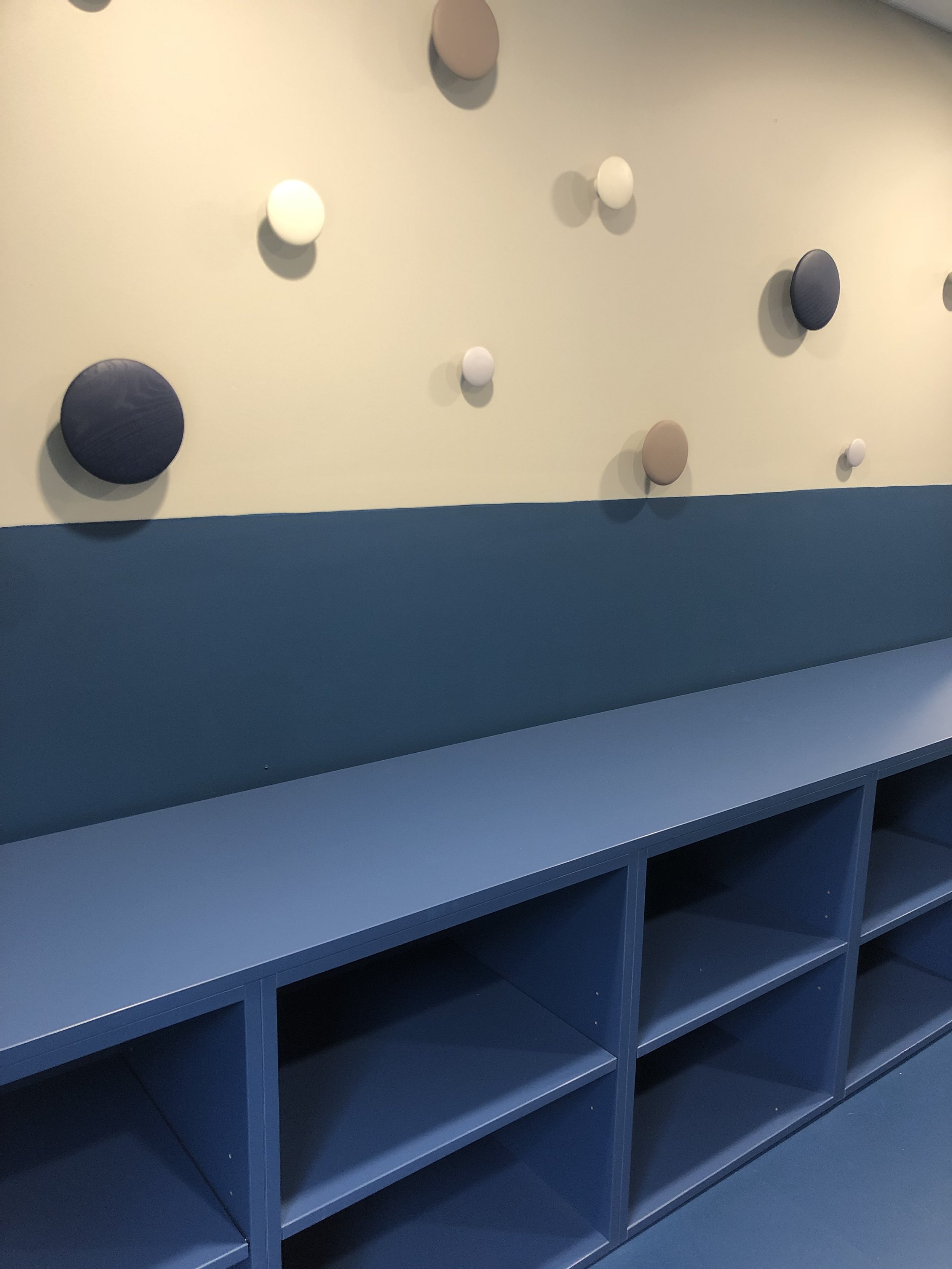 Blue ballet studio with coat hooks