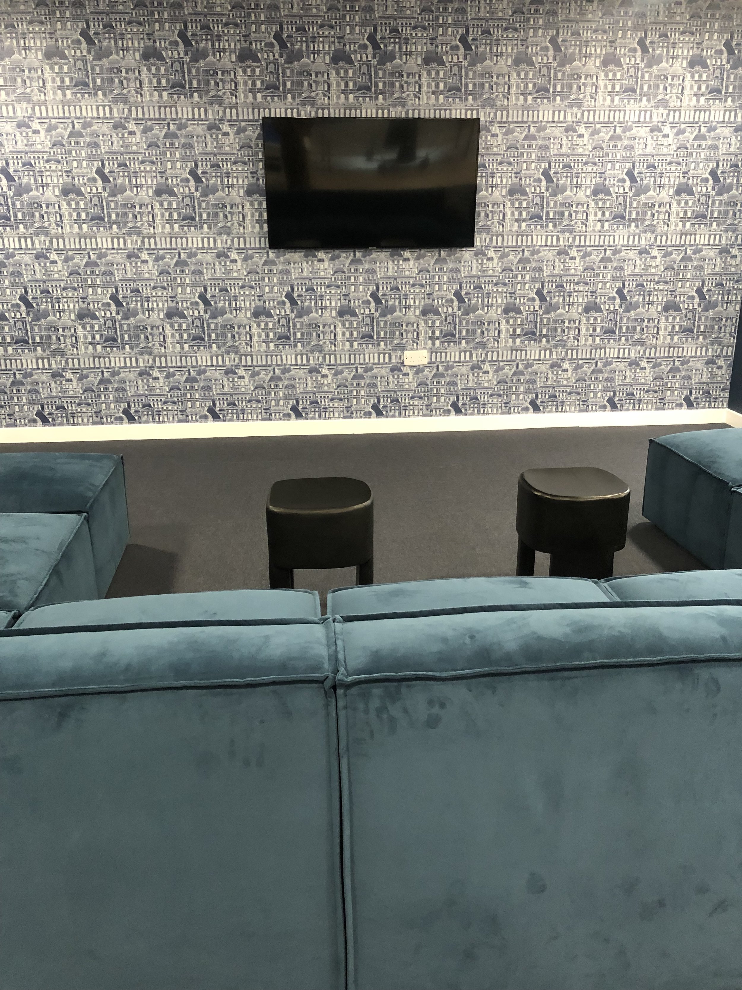 TV area with blue sofa