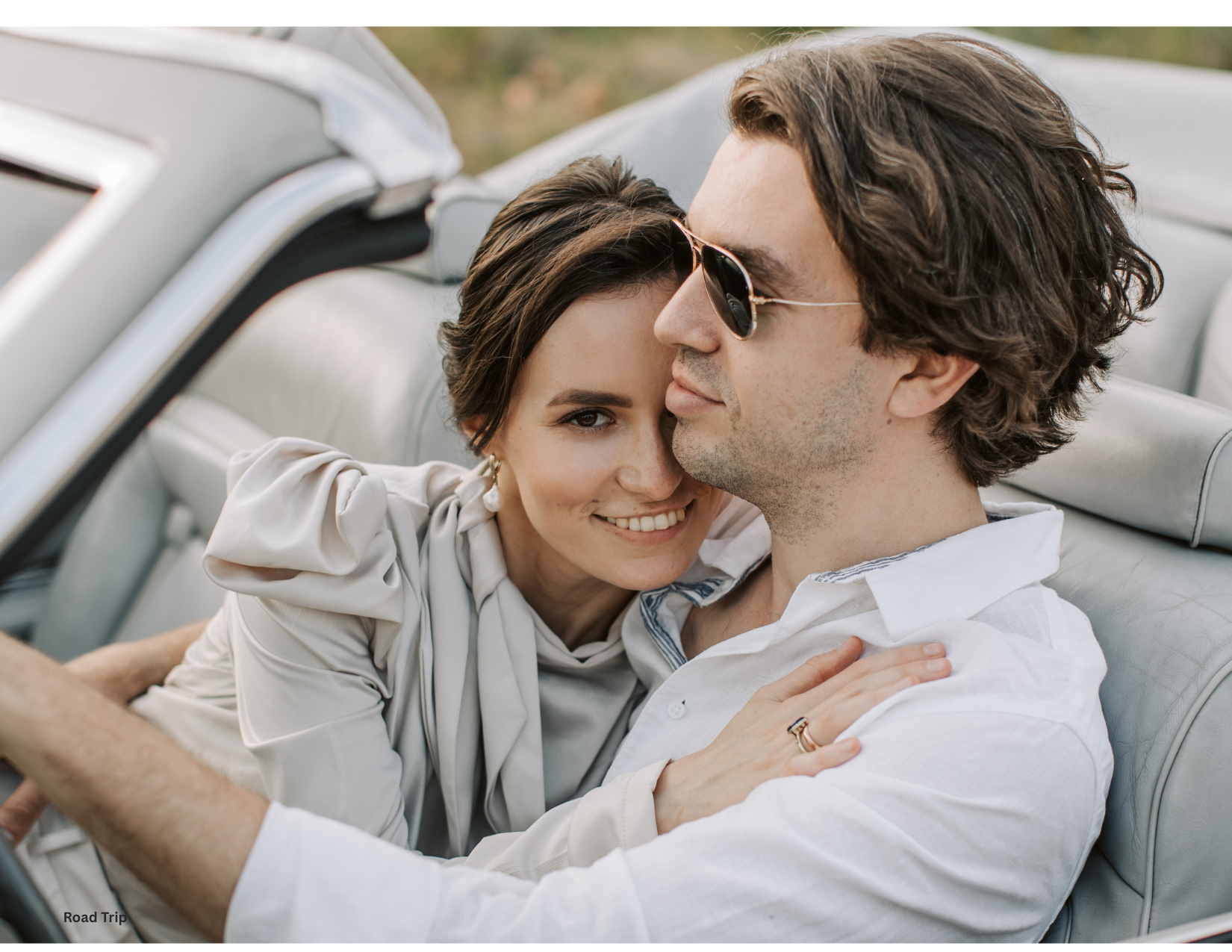 Engaged couple enjoying a romantic road trip in Cincinnati during sunset