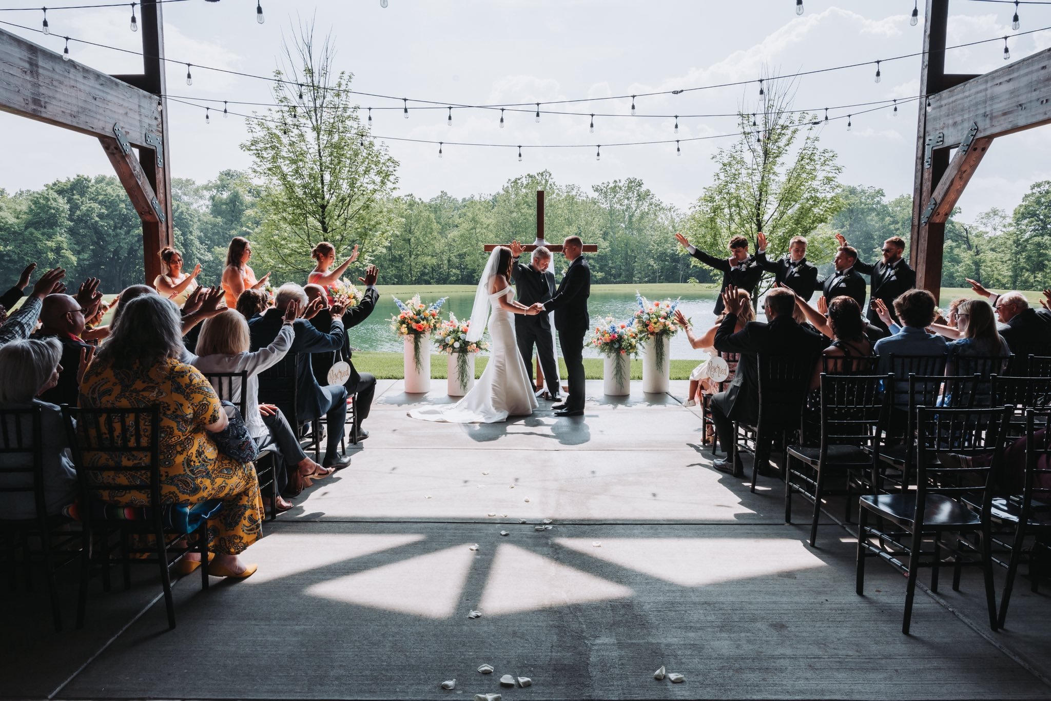 Gorgeous green spring wedding ceremony with forest, pond & fountain backdrop near Cincinnati.