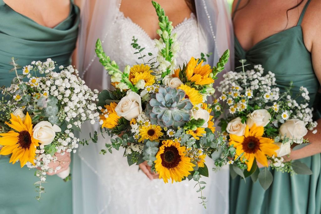 Bride and bridesmaids holding luxury wedding flowers