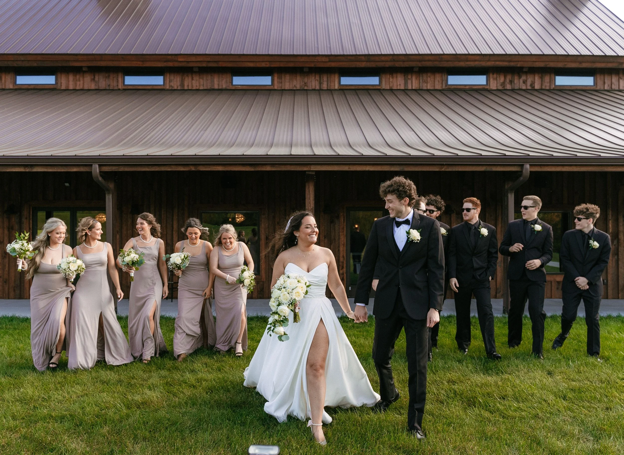 Our beautiful bride and groom are accompanied by their wedding party all wearing a formal wedding dress code at our Cincinnati wedding venue.