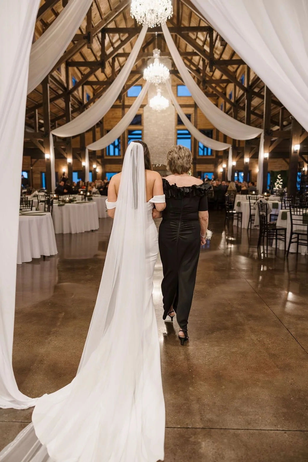 Bride walking down the aisle at an indoor wedding reception near Cincinnati
