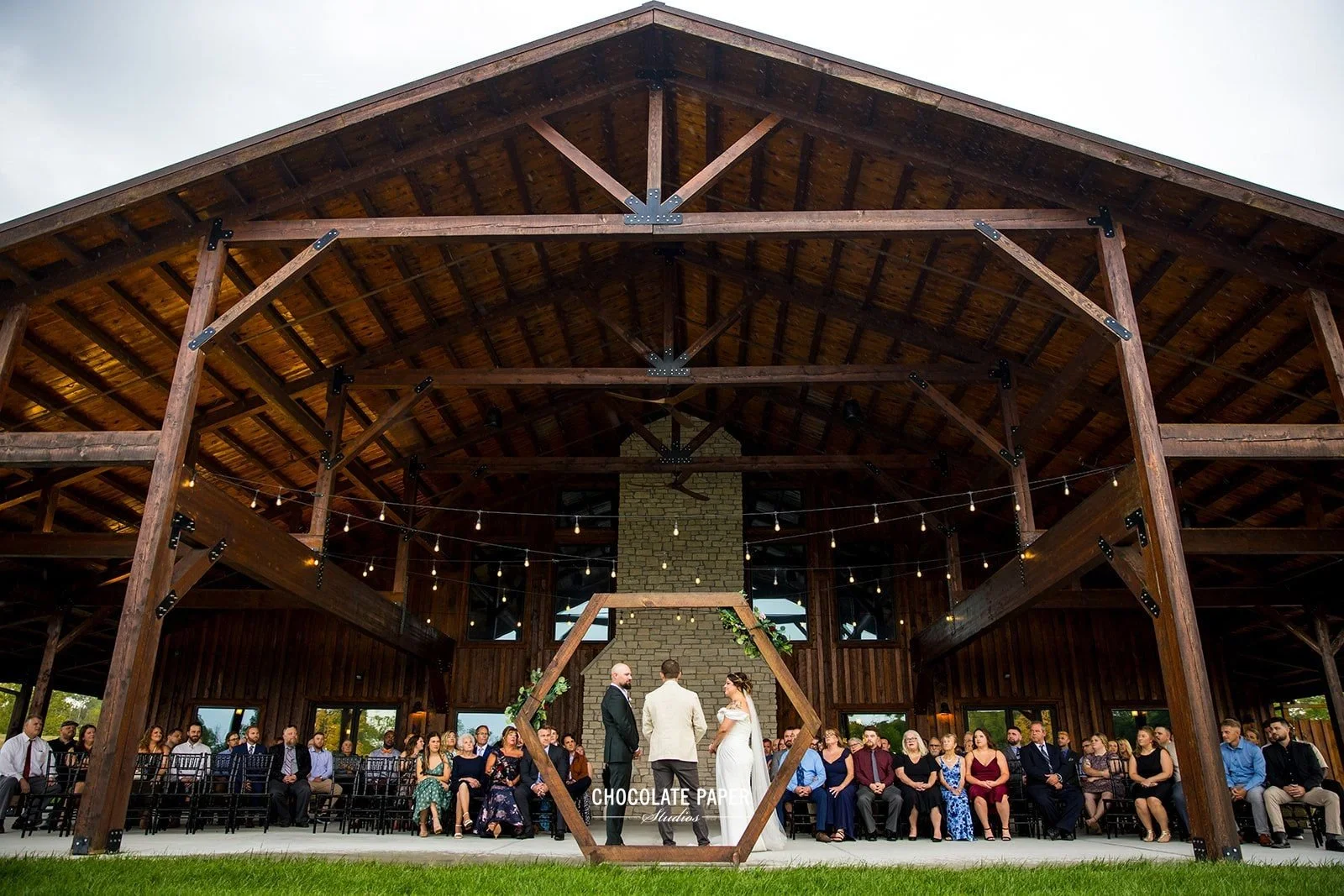 Outdoor wedding ceremony near Cincinnati featuring luxury chairs, lodge style wedding venue styling a plenty of room for up to 400 wedding guests.