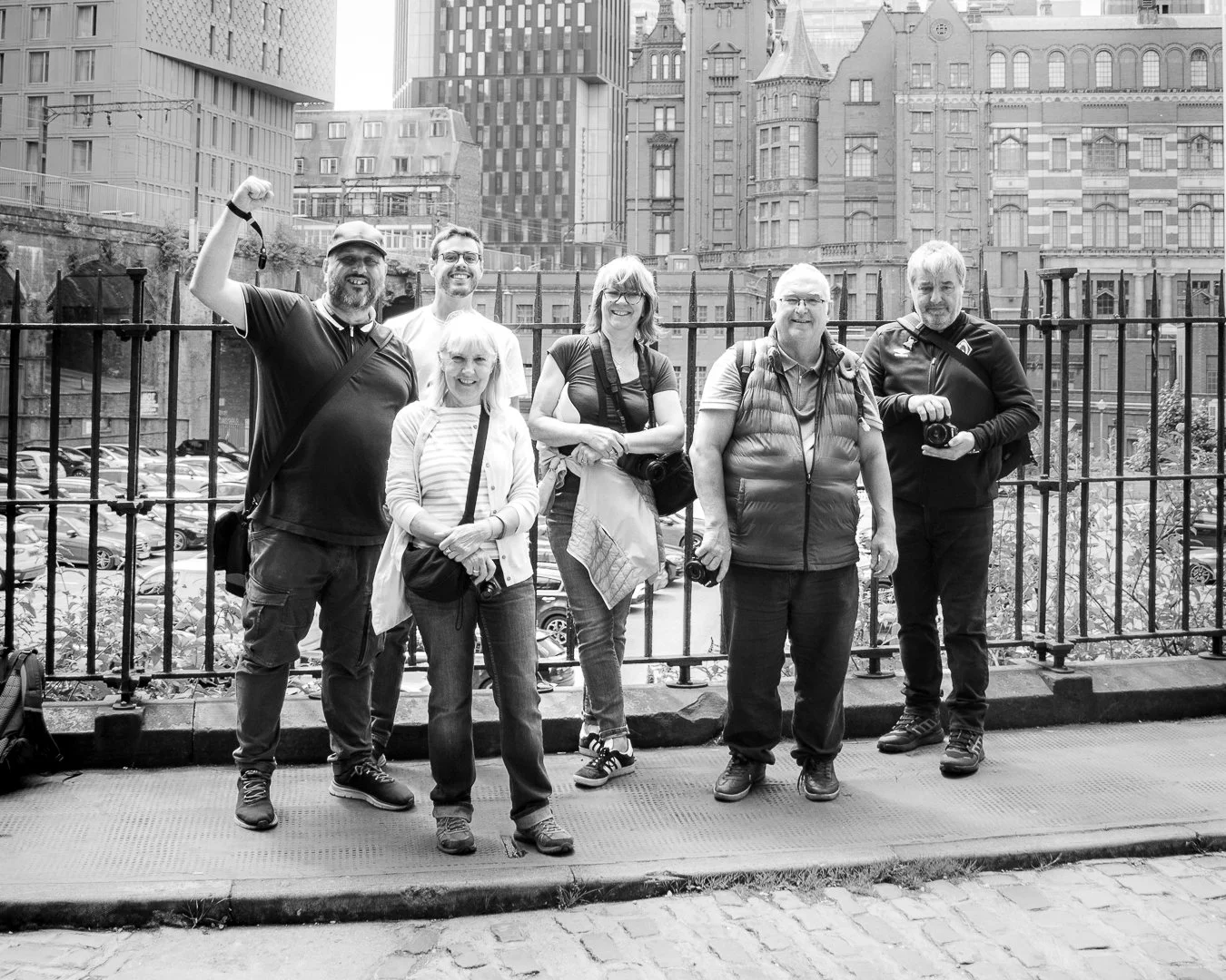 Dave and Group of beginner photographers during practical photography workshop in Manchester City centre