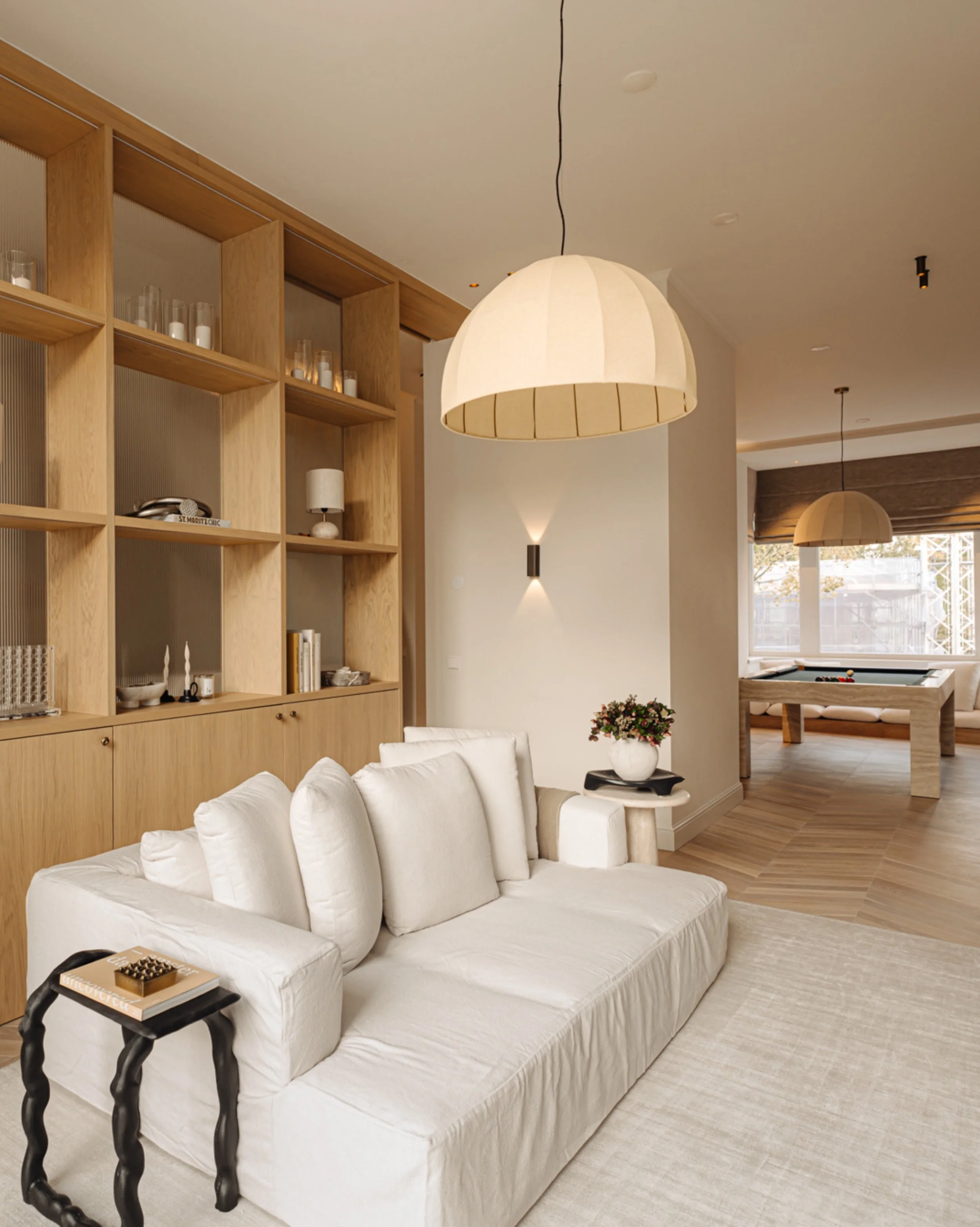 Project VE - Sometimes one element can completely shape a space. For this home, the custom light oak cabinet became more than just storage. It creates different zones while keeping the interior open and connected.
