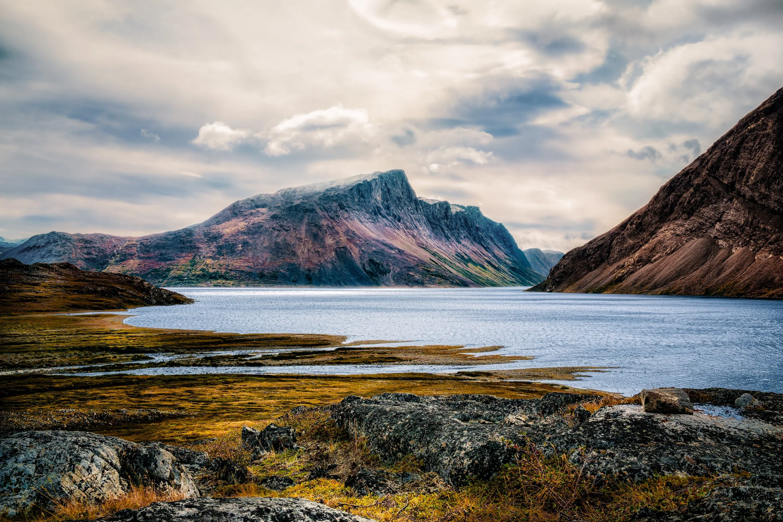 The Torngats.  Walked  up a hill to a viewpoint. Wearing about 4 layers of clothing.  And always a life jacket.  If a polar bear was seen nearby, we had to be able to quickly get to a zodiac and take off.  No time to put on the life jacket.