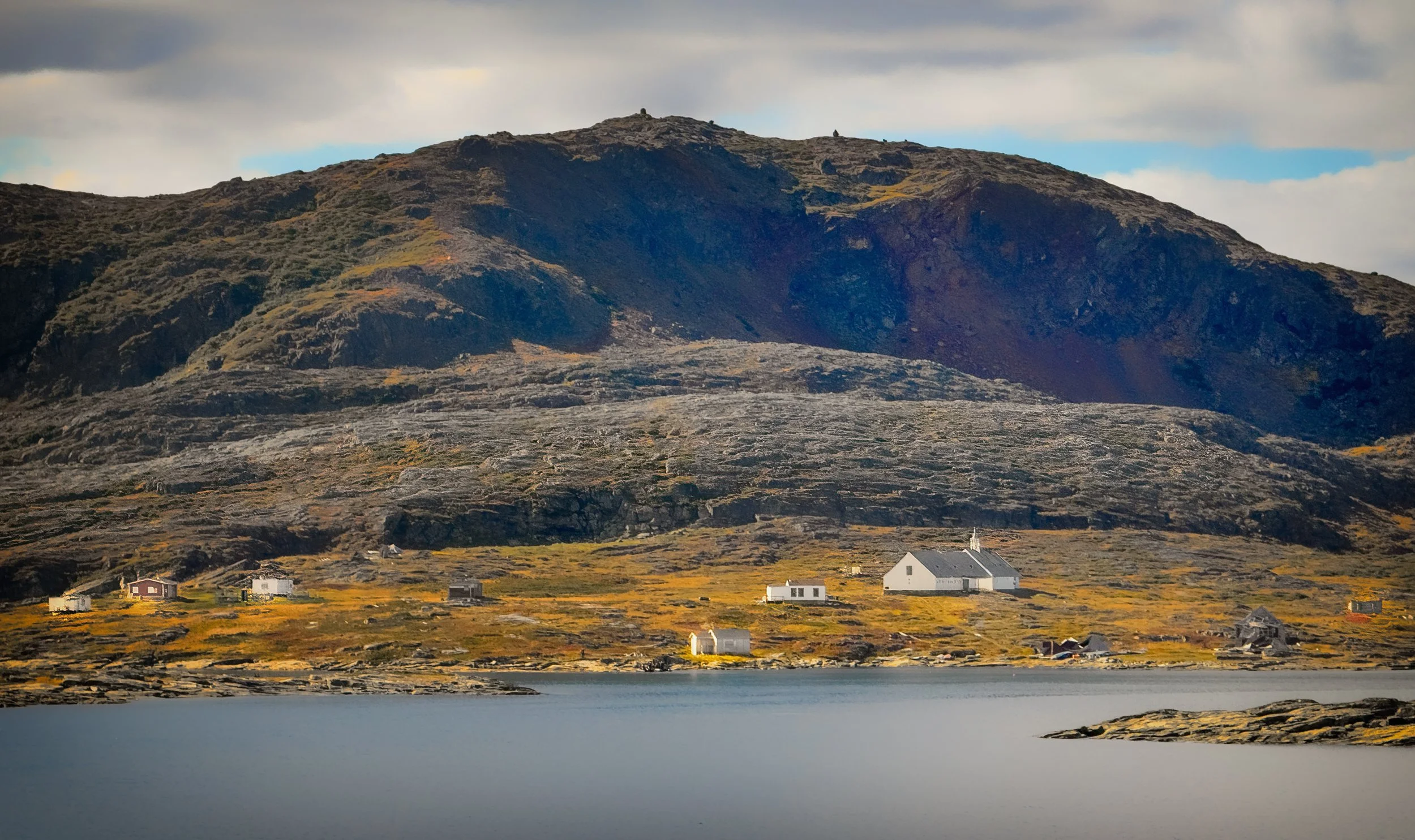Approaching Hebron, in northern Labrador. The most noticeable building on the landscape is the church. 