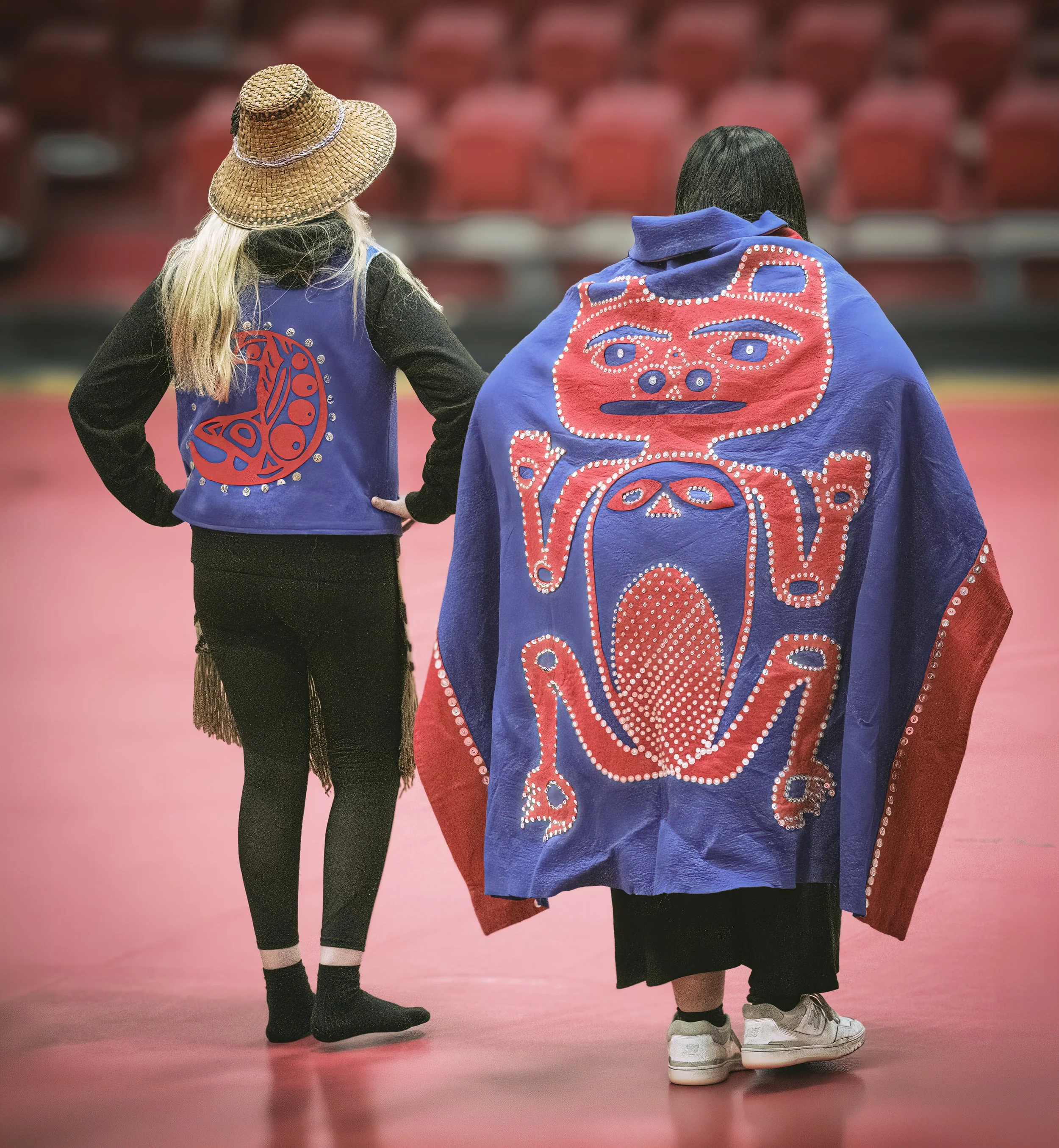 Traditional dancing and storytelling wearing beautiful handmade clothing passed down through generations depicting Tlingit  Imagery.