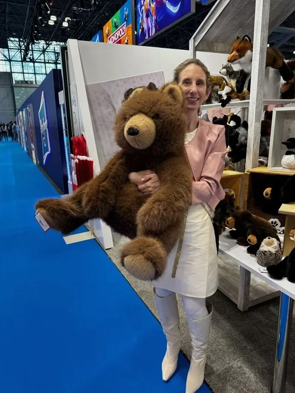 JJ, the brown bear, enjoying a cuddle from Heidi...coming in the Fall!