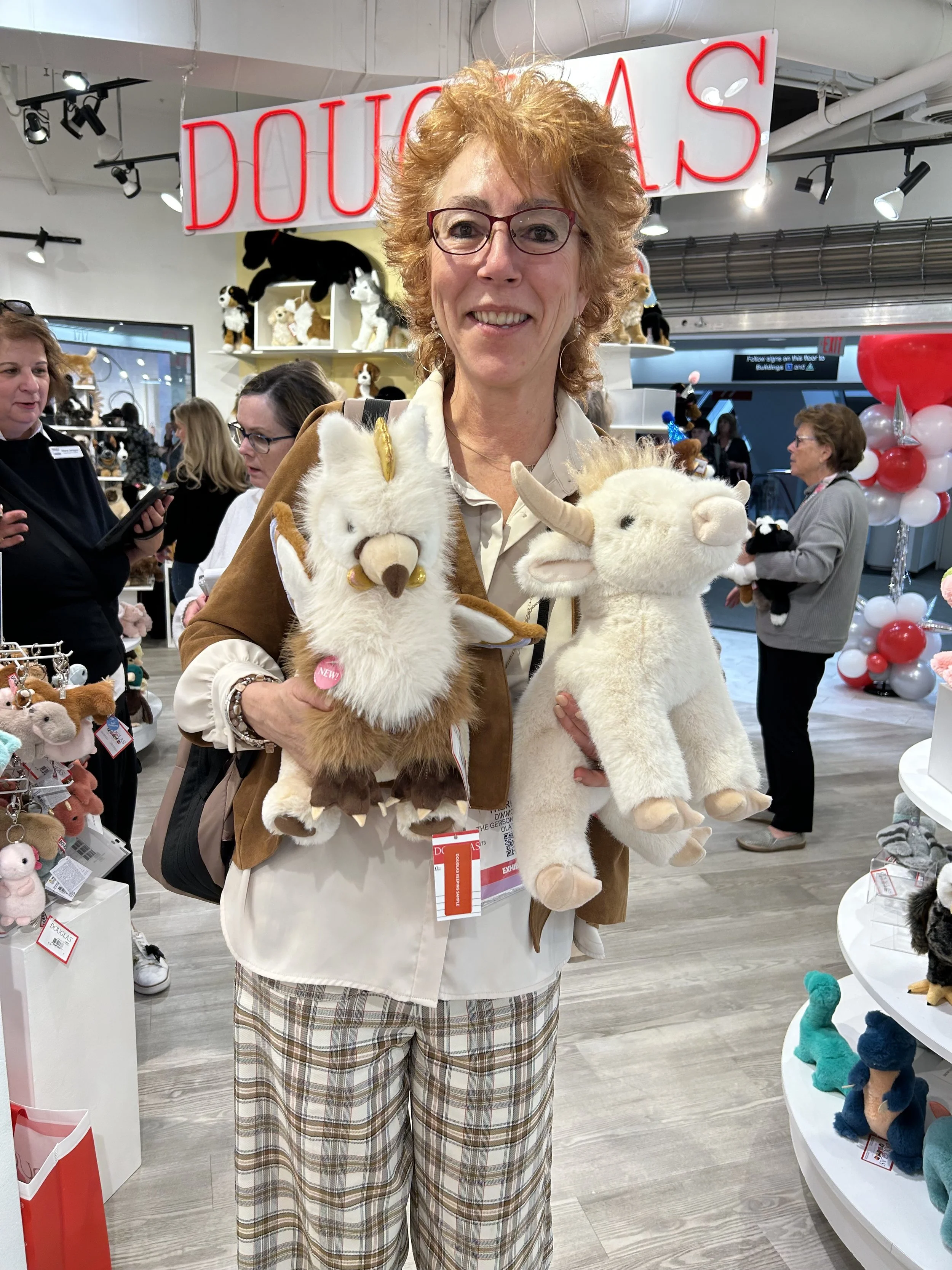 Theresa with Glorie the Gryphon and Laddie the Highland Cow