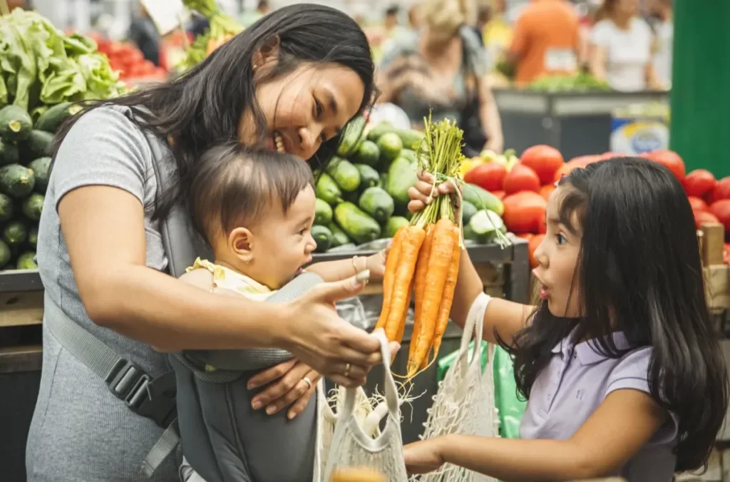 A family shopping at a farmers market together
