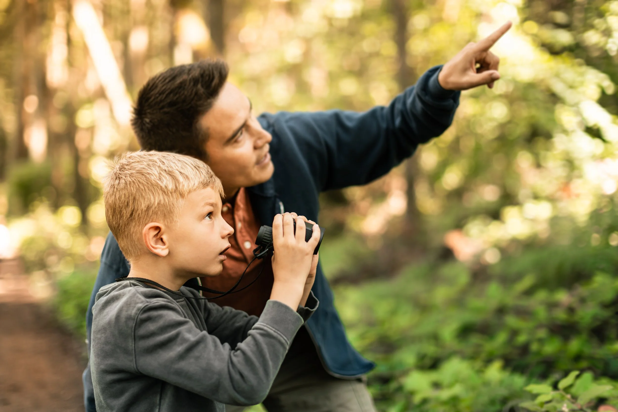 Parent and child spending calm, connected time outdoors, reflecting whole-child care and understanding.