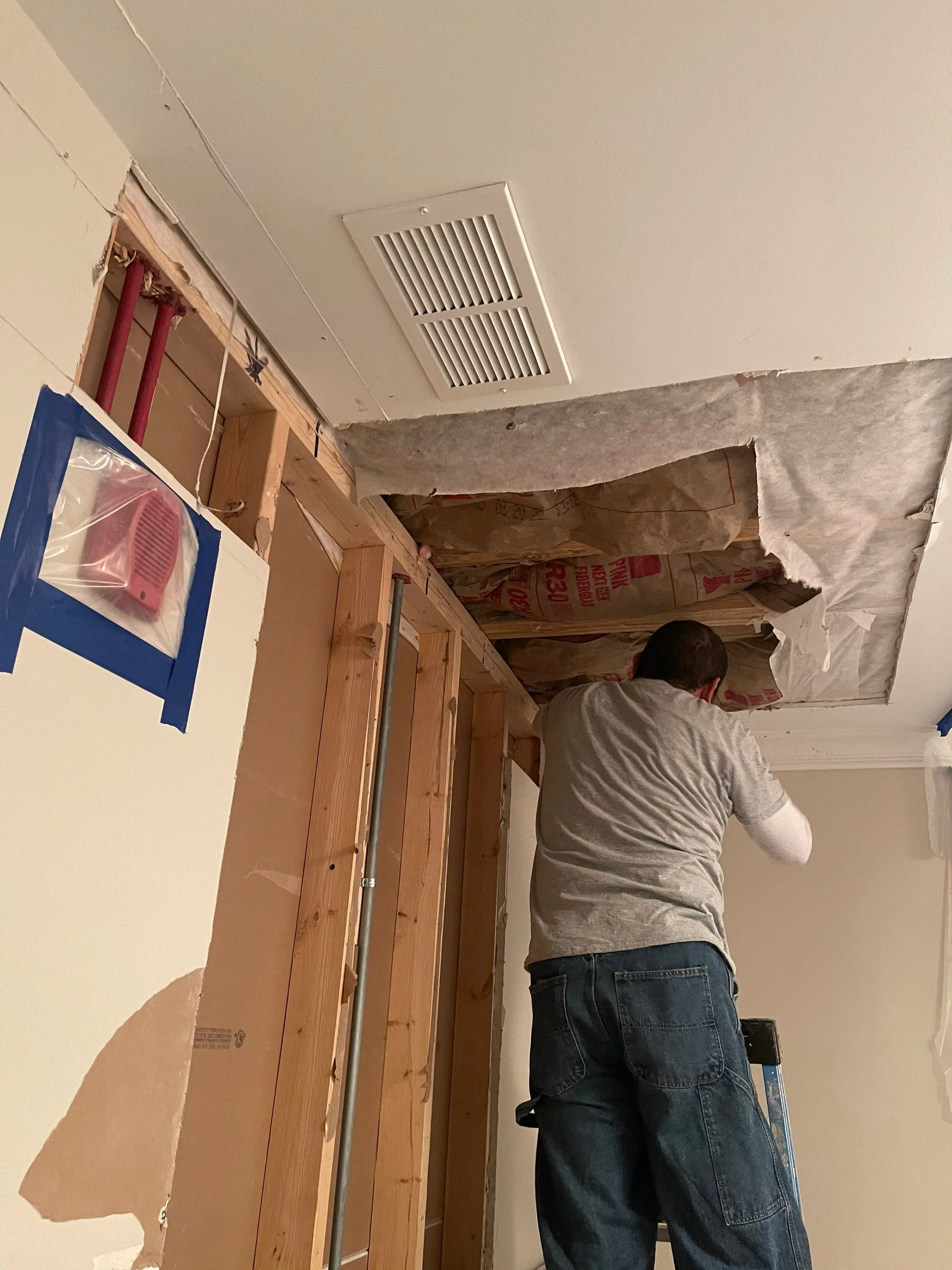 Drywall and insulation removed during water damage restoration