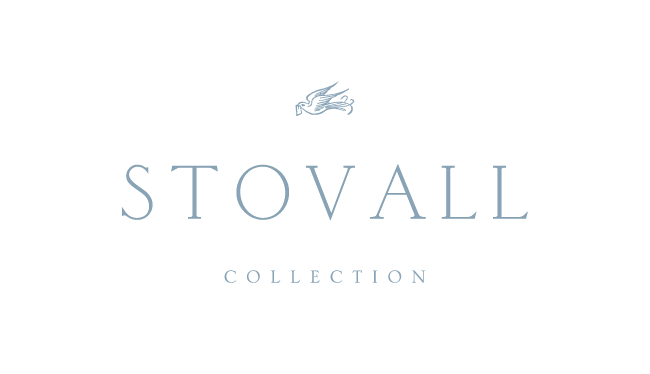 Stovall Collection logo with a stylized mythical creature resembling a dragon at the top on a black background.