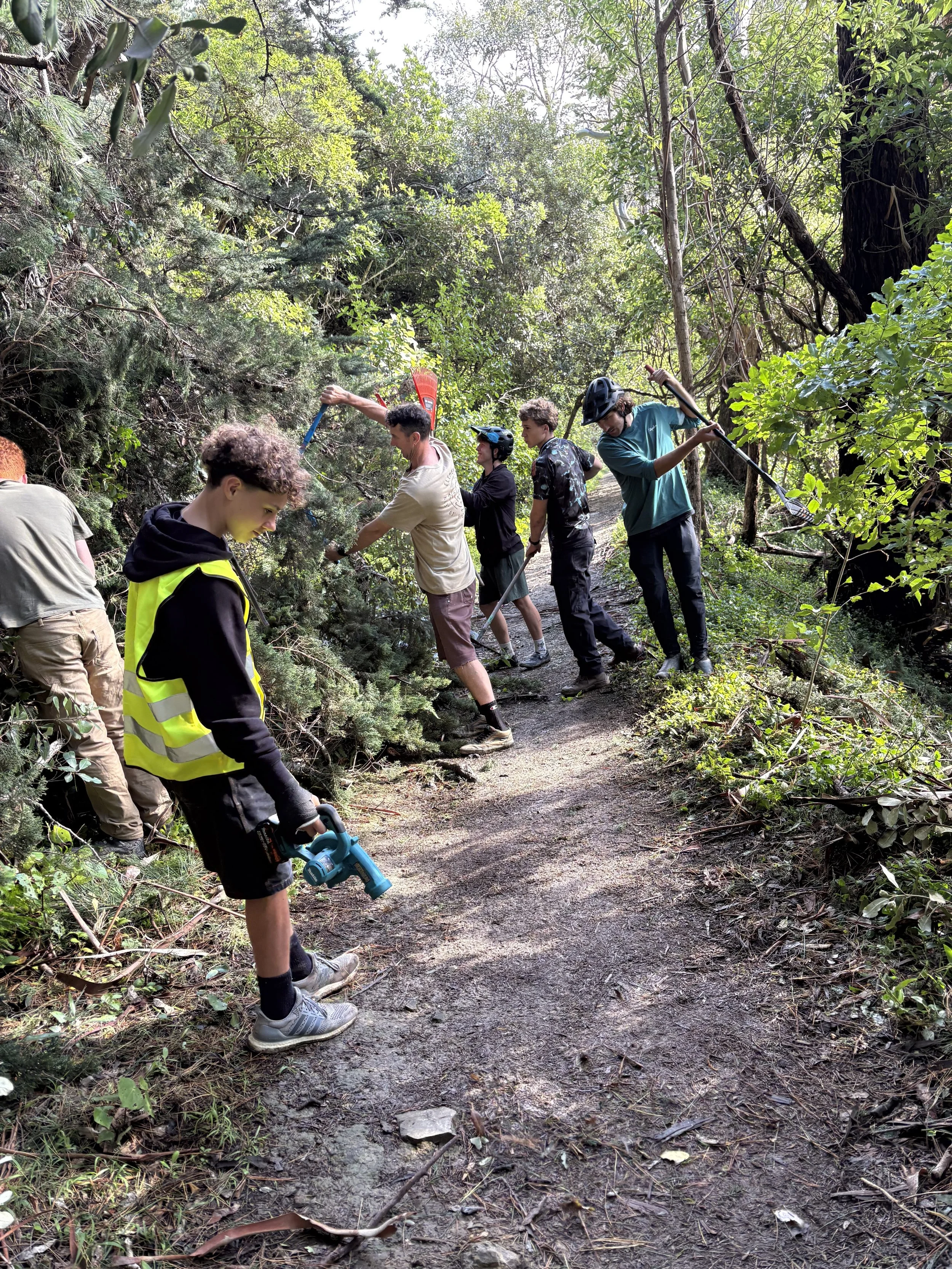 Fast ForWORD Team chipping in to clean up trails after the storm