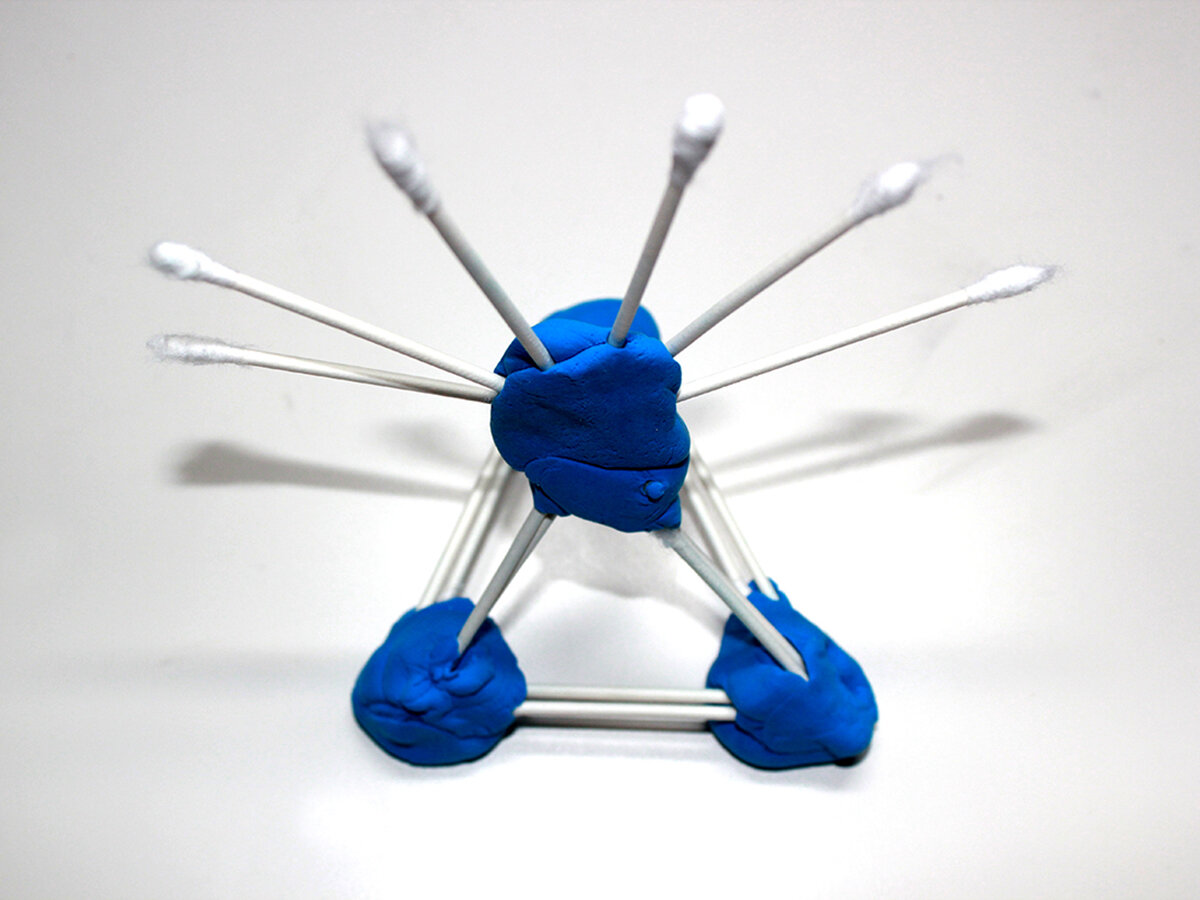 Geometric abstract art with blue clay and cotton swabs (front view)