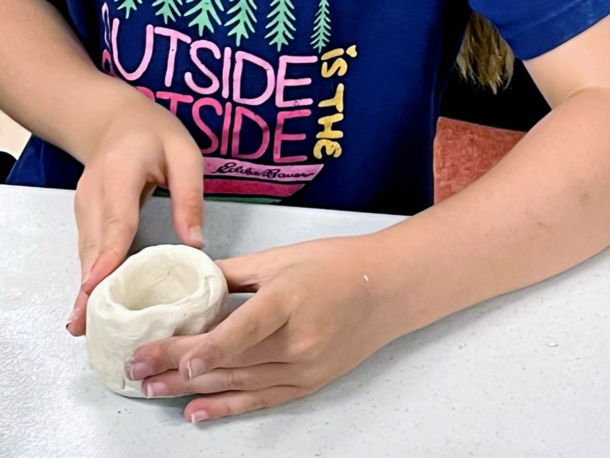 Student Scuplting Clay Pot