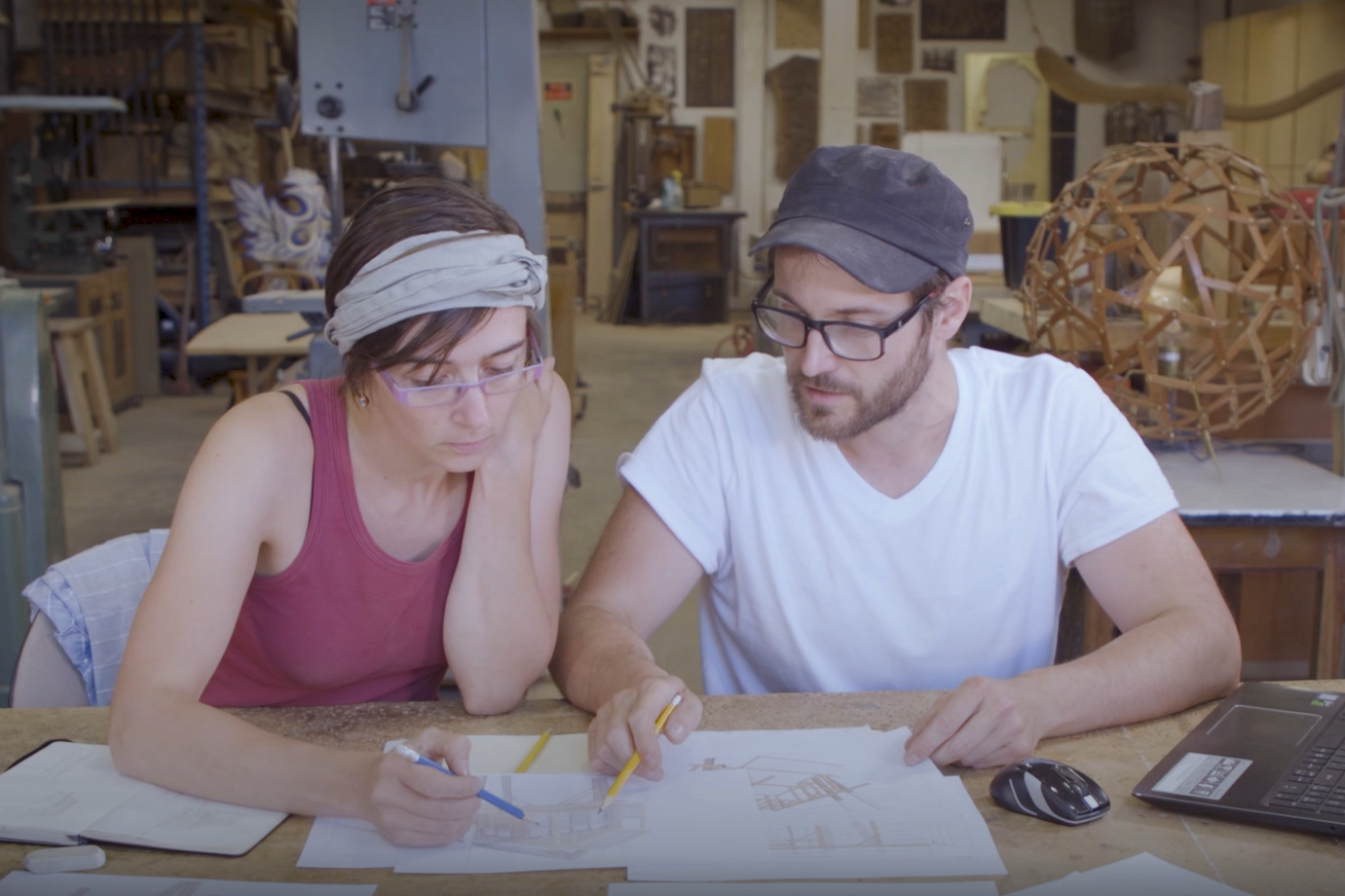 Coraline and Pierre go over designs in their Toronto workshop.