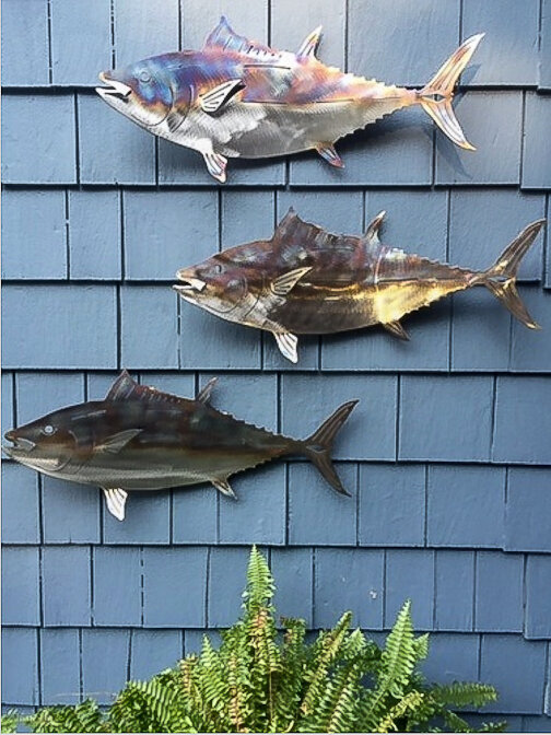 And example of Tyson’s metal Fish In The Garden adding an artistic element to a cedar shake wall.