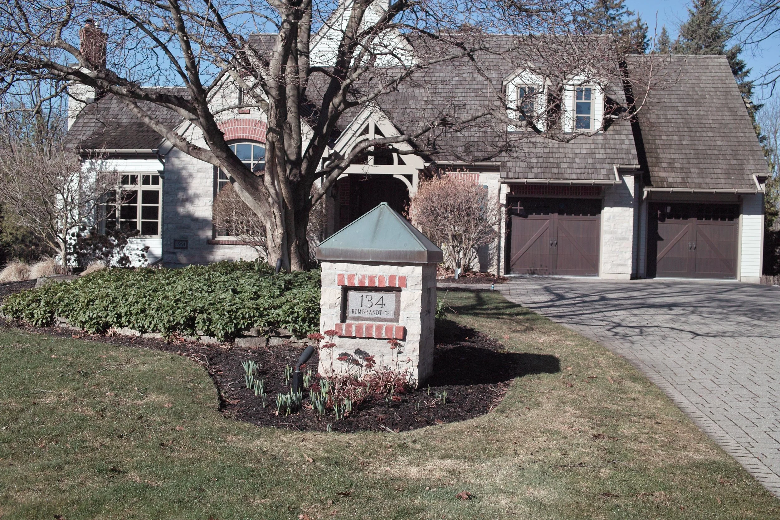 Small architectural knee wall reflects the home's architecture.