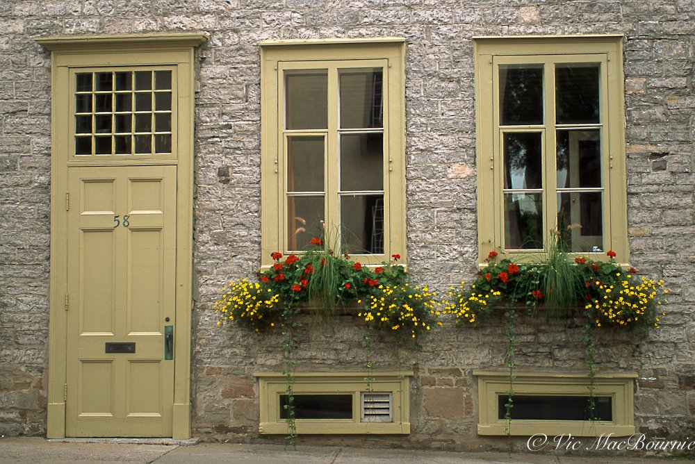 Window boxes on historic building in Quebec City.