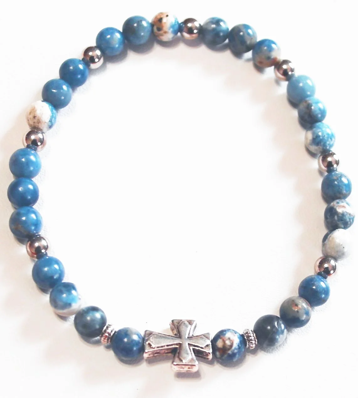 #17  Varying shades of blue stone beads with glints of white and grey.