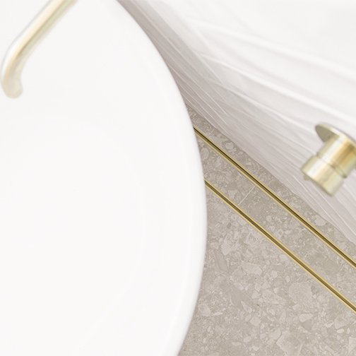 Gold-tile-insert-installed-in-bathroom.jpeg