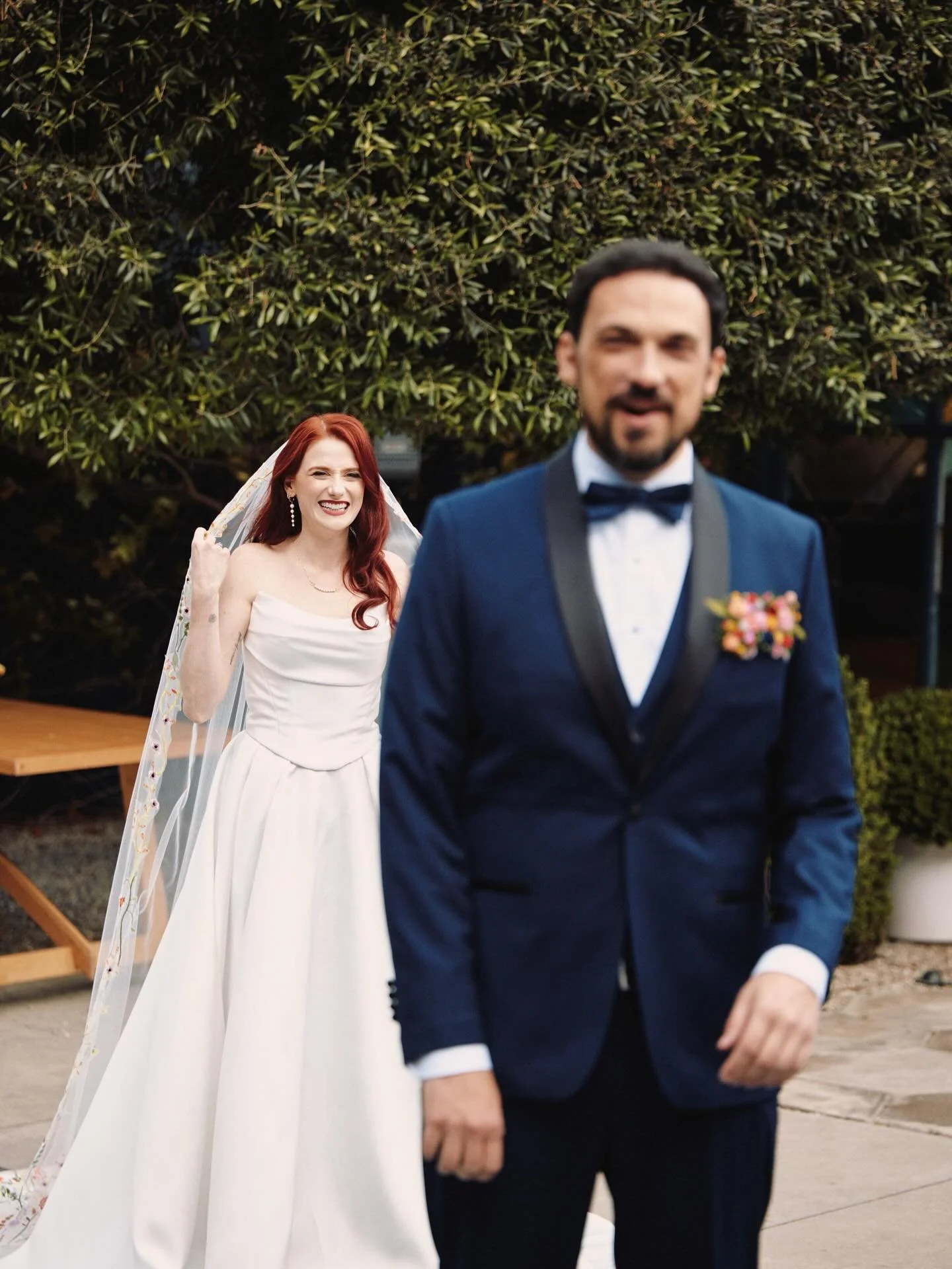 That first look magic!!! Our gorgeous bride stepped out to surprise her soon-to-be husband with the biggest smile, and it was pure joy. We created her timeless beauty look with a soft, modern Hollywood wave and stunning glam to complement her fabulou