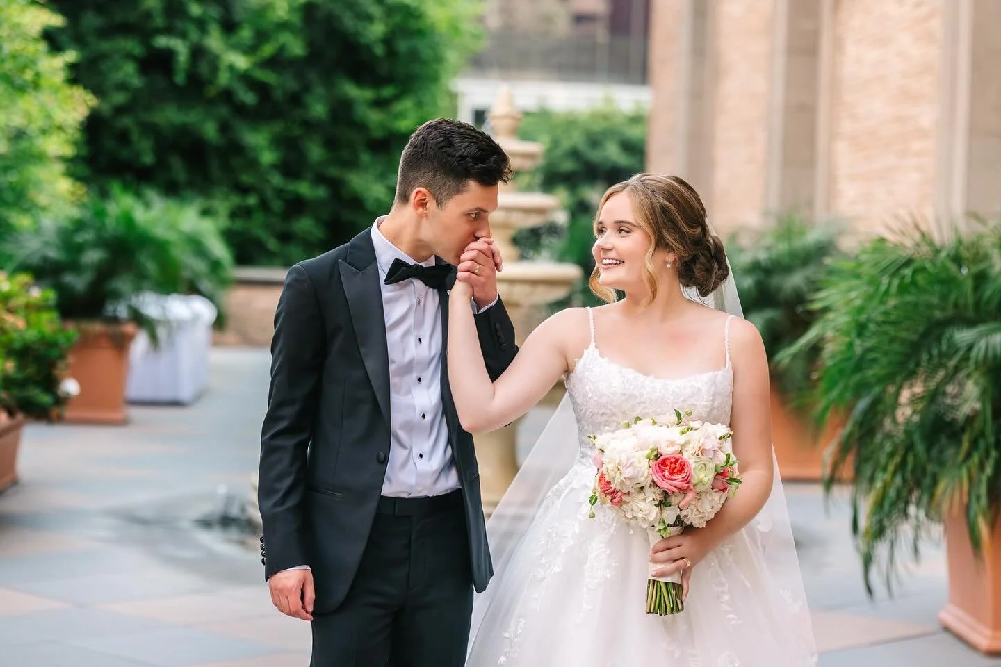 A timeless moment 🤍 Our stunning bride walking hand in hand with her husband as he sweetly kisses her hand. We created a soft, elegant makeup look paired with a classic updo so effortlessly beautiful and classic. ✨

We love being a part of these unf