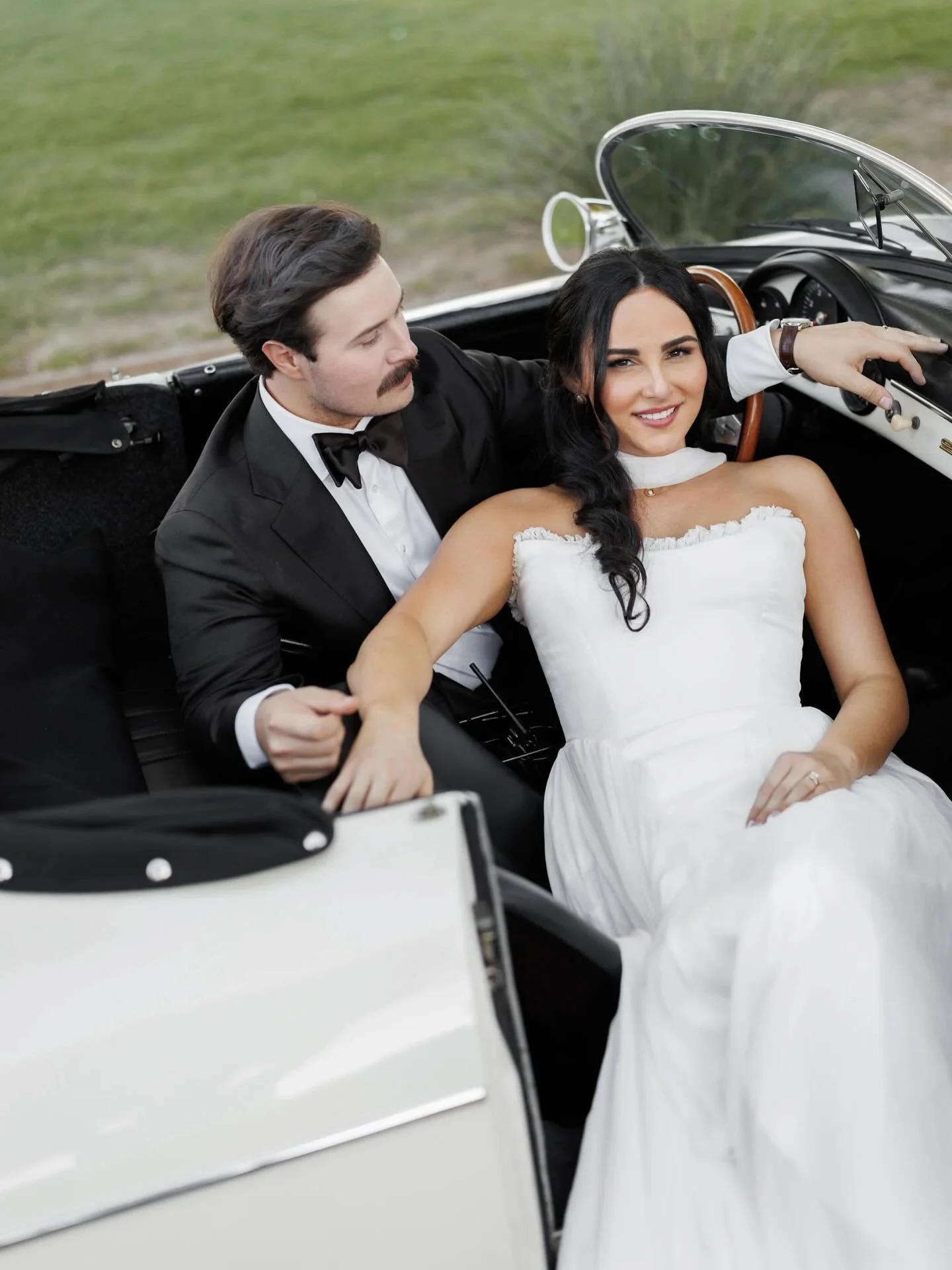 A moment straight out of a magazine ✨Our stunning bride and her groom giving timeless, editorial elegance in the heart of Palm Springs, captured in the most iconic vintage car moment. Every detail feels like a cover story, and we are absolutely obses