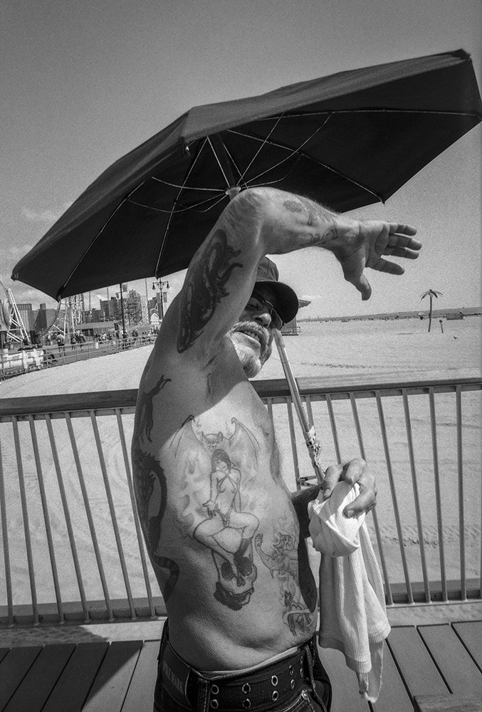 08_Man Under Umbrella 1000pixels Showing Tattoo copy.jpg