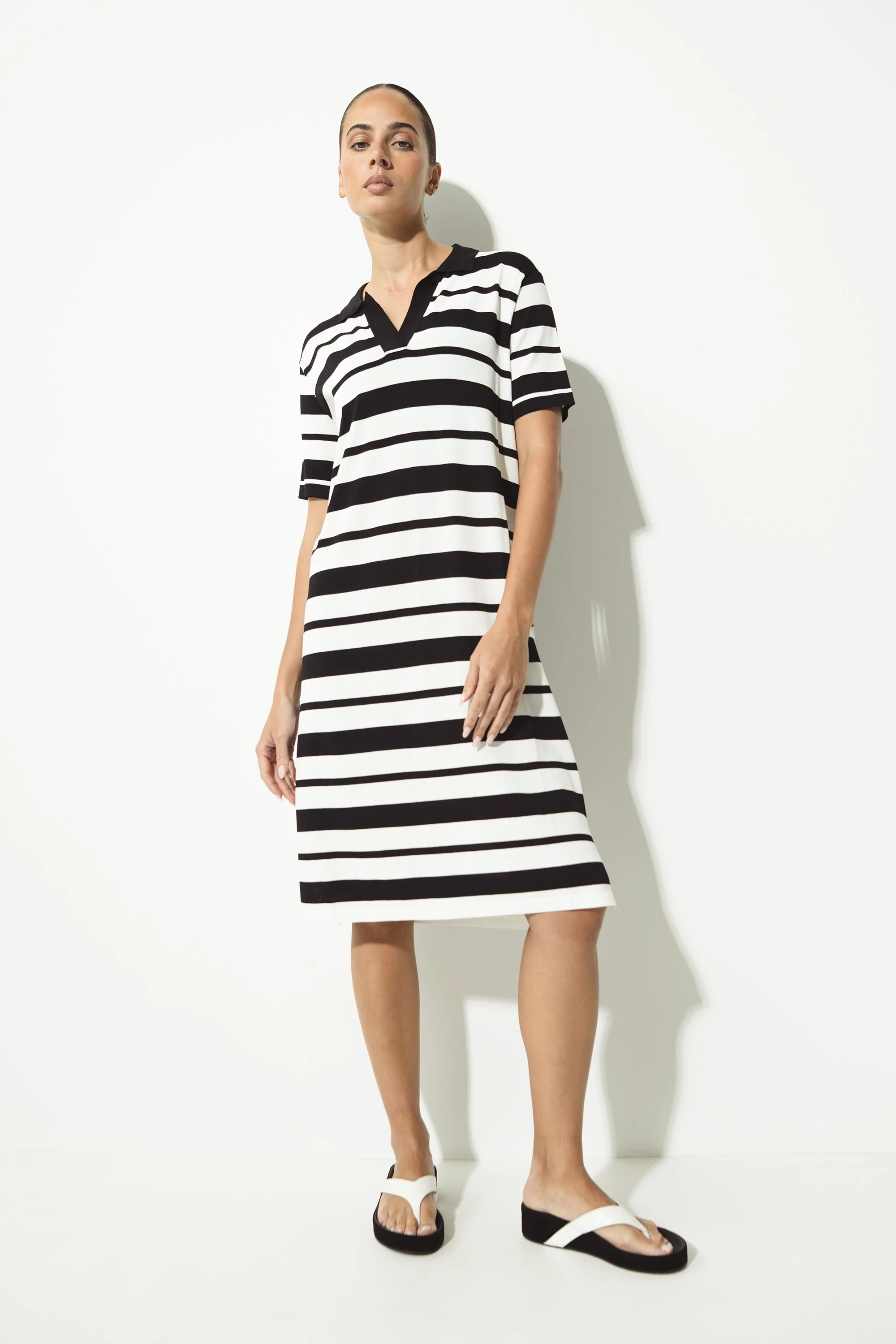 LOUNGE | BLACK AND WHITE STRIPED KNIT POLO DRESS.