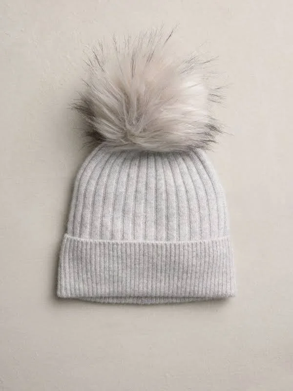 GREY CASHMERE BEANIE WITH RACCOON POM-POM.