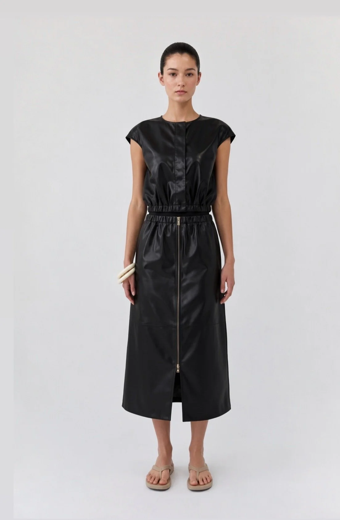 DEA | BLACK LEATHER ZIP FRONT SKIRT.